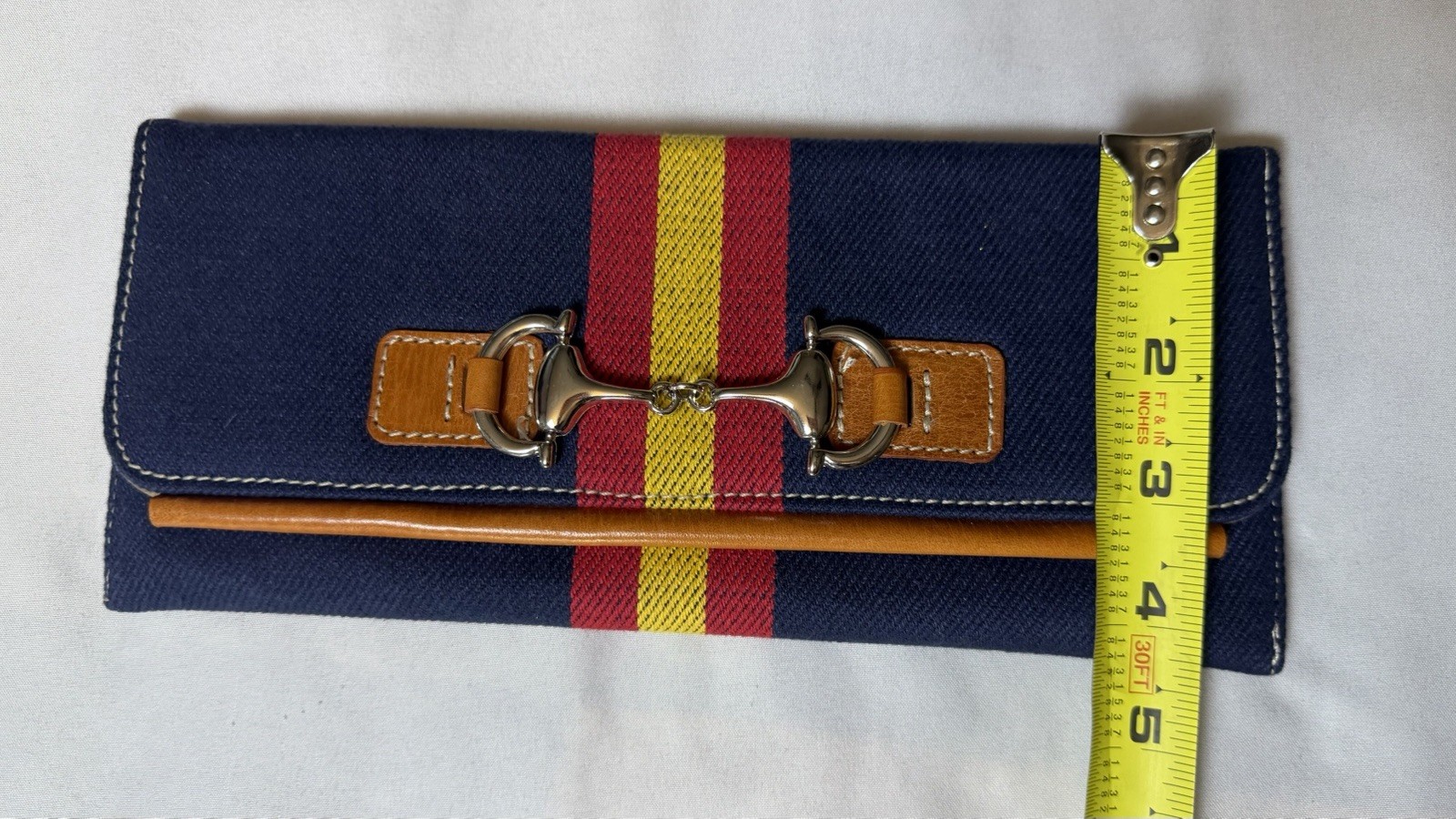 Blue Canvas Clutch With Silver Hardware On Front, Red And Yellow Stripes