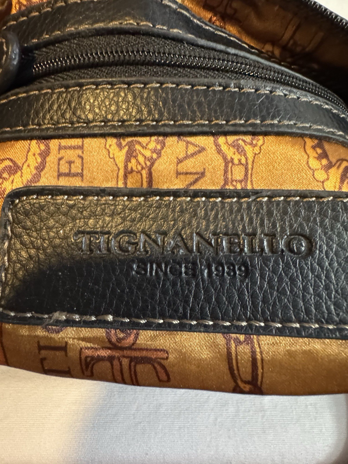 Tignanello Black Pebbled Leather Crossbody Bag White Accent Stitching & Logo