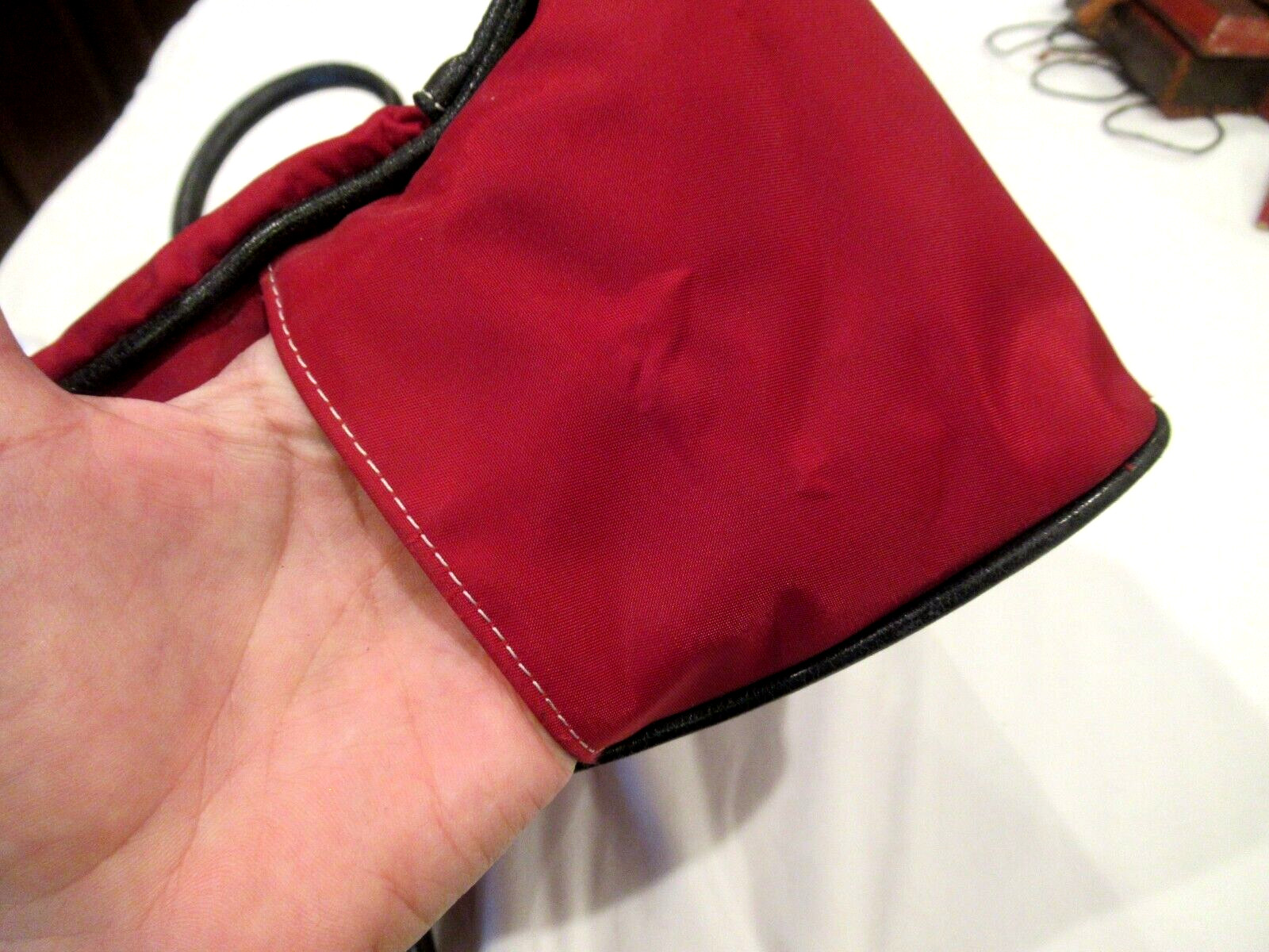 Chelsey Henry red purse with black trim, lots of pockets