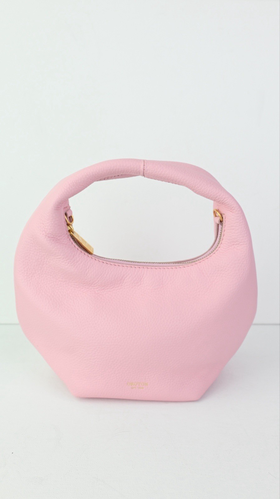 OROTON “Tulip Mini” leather day bag in tulip pink