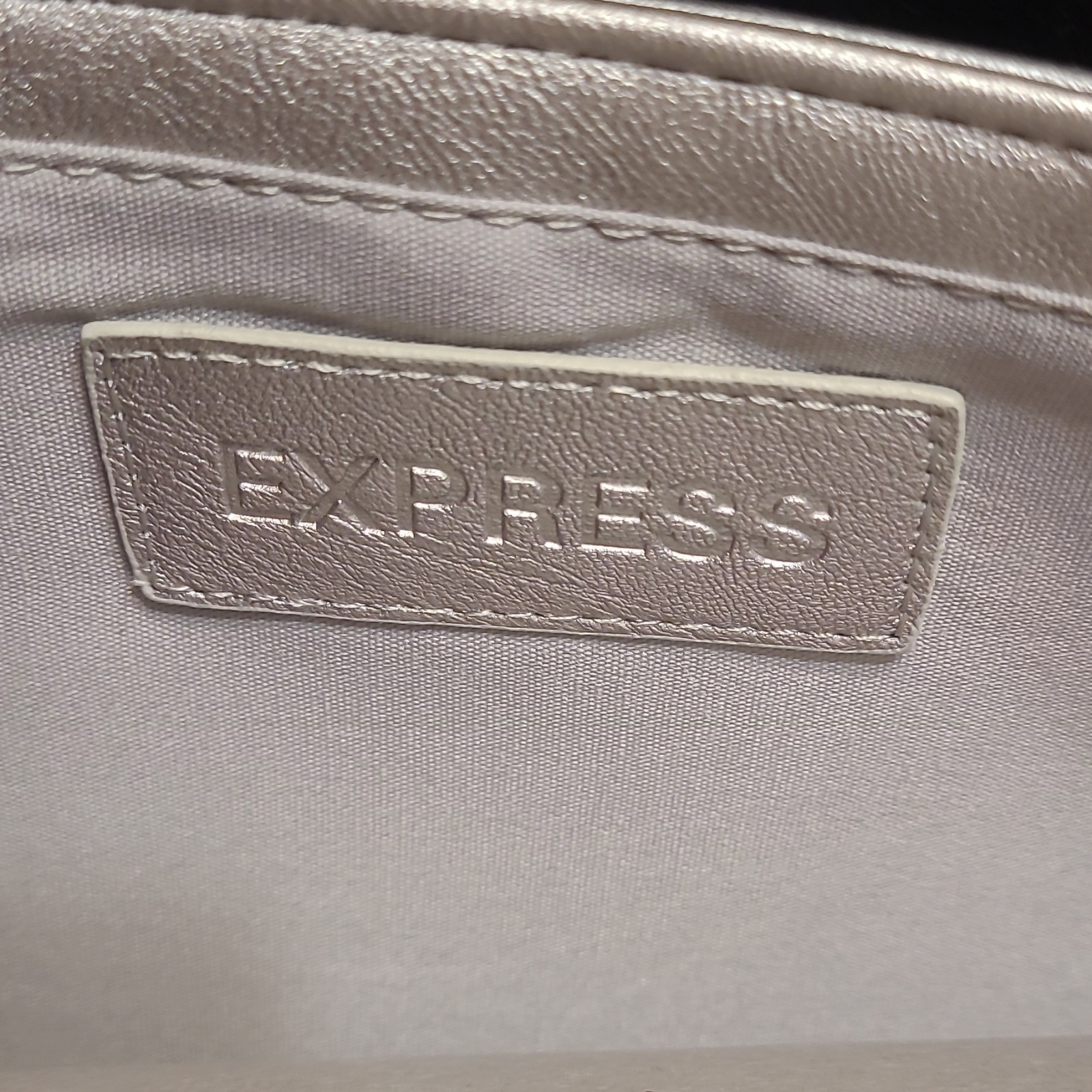 Express Metallic Silver Clutch Cut-Out Top Handle Magnetic Closure Women’s