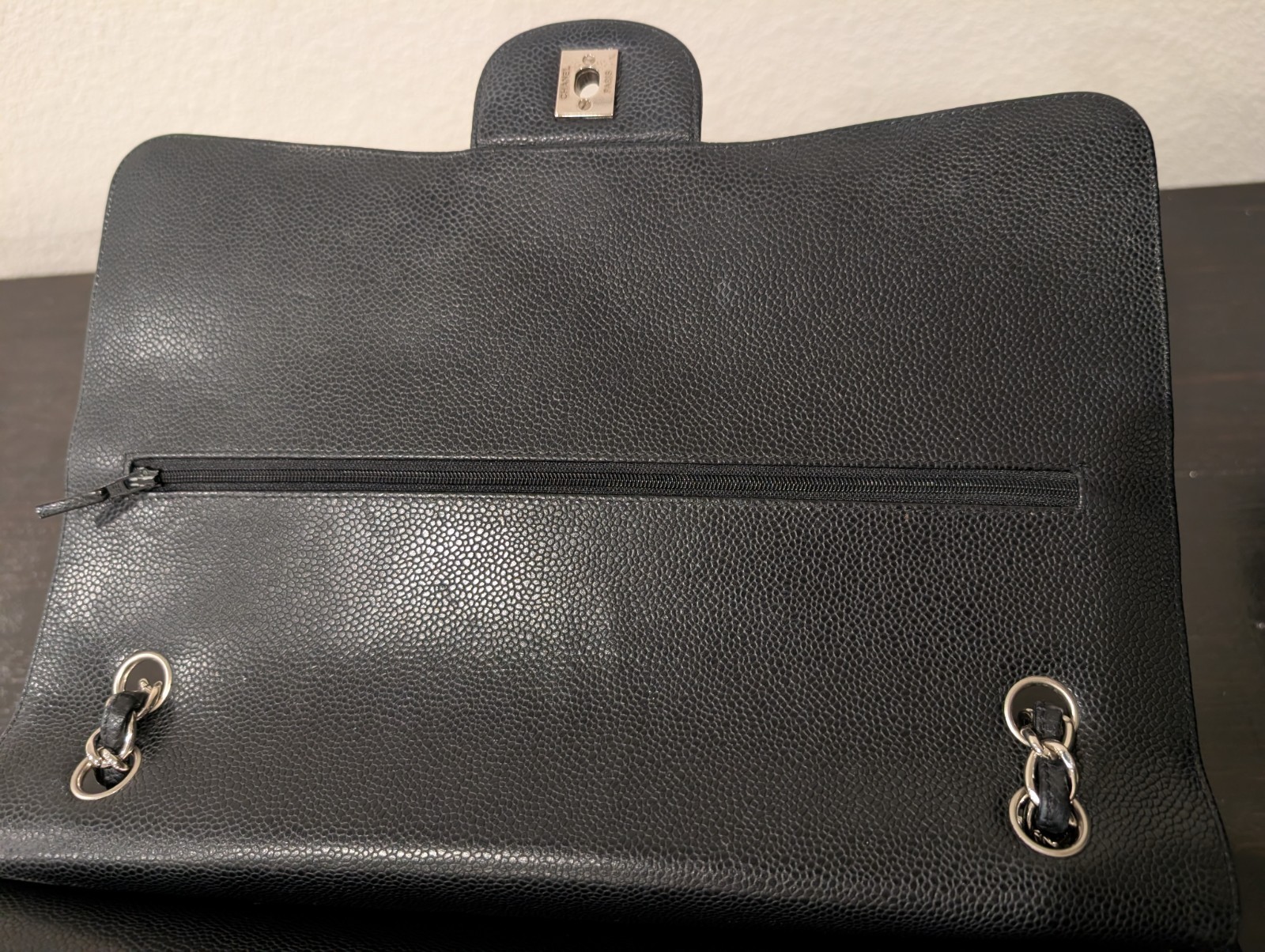 CHANEL Maxi Classic Double Flap Caviar Black Leather Bag. Circa 2011 Storyline