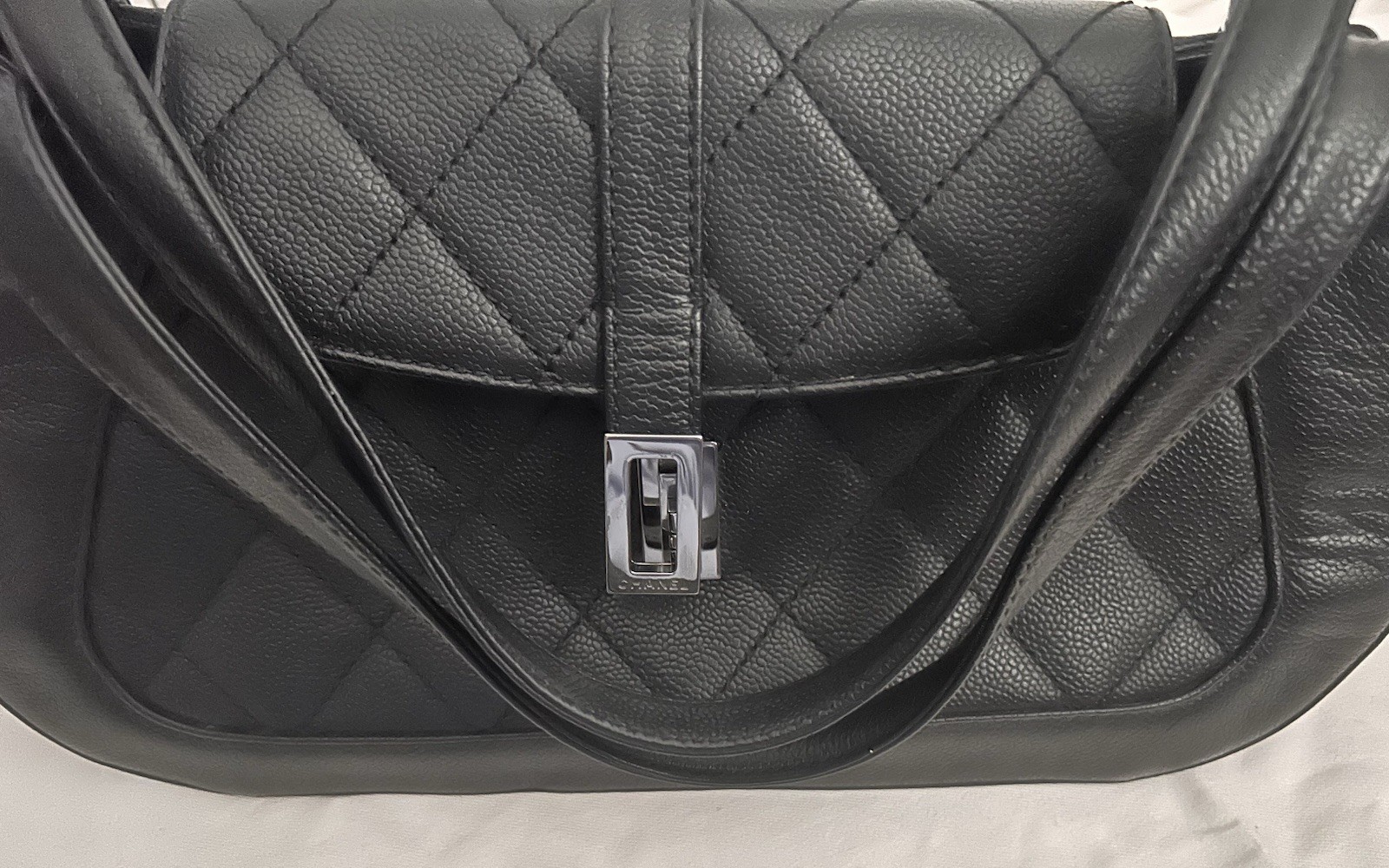 CHANEL Black Quilted Shoulder Bag with Turn Lock & Silver Hardware