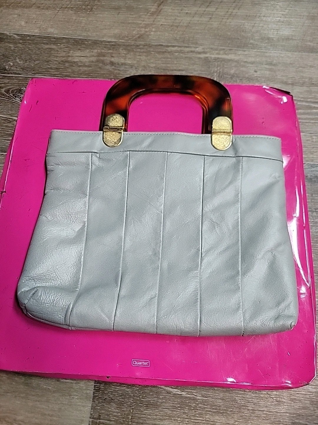 Grey leather handbag with a tortoise handle clutch purse