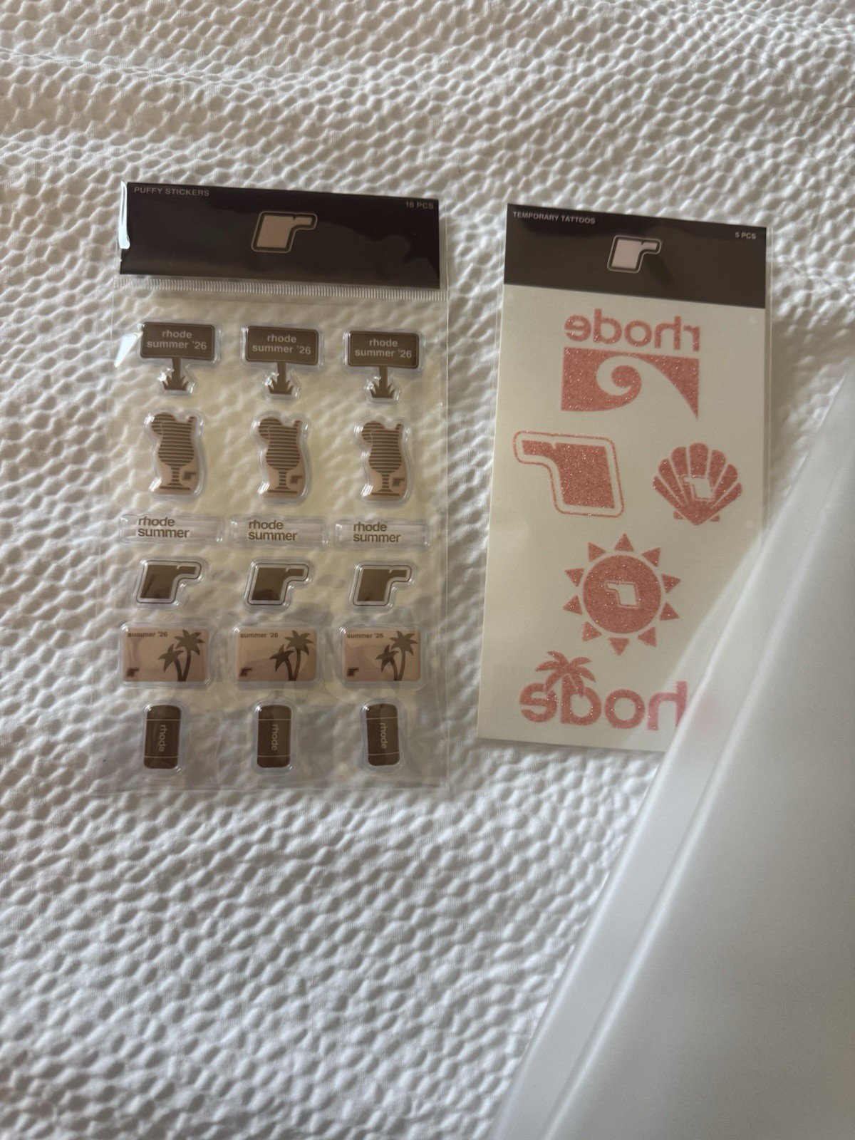 Rhode White Plastic Tote with stickers and temporary tattoos