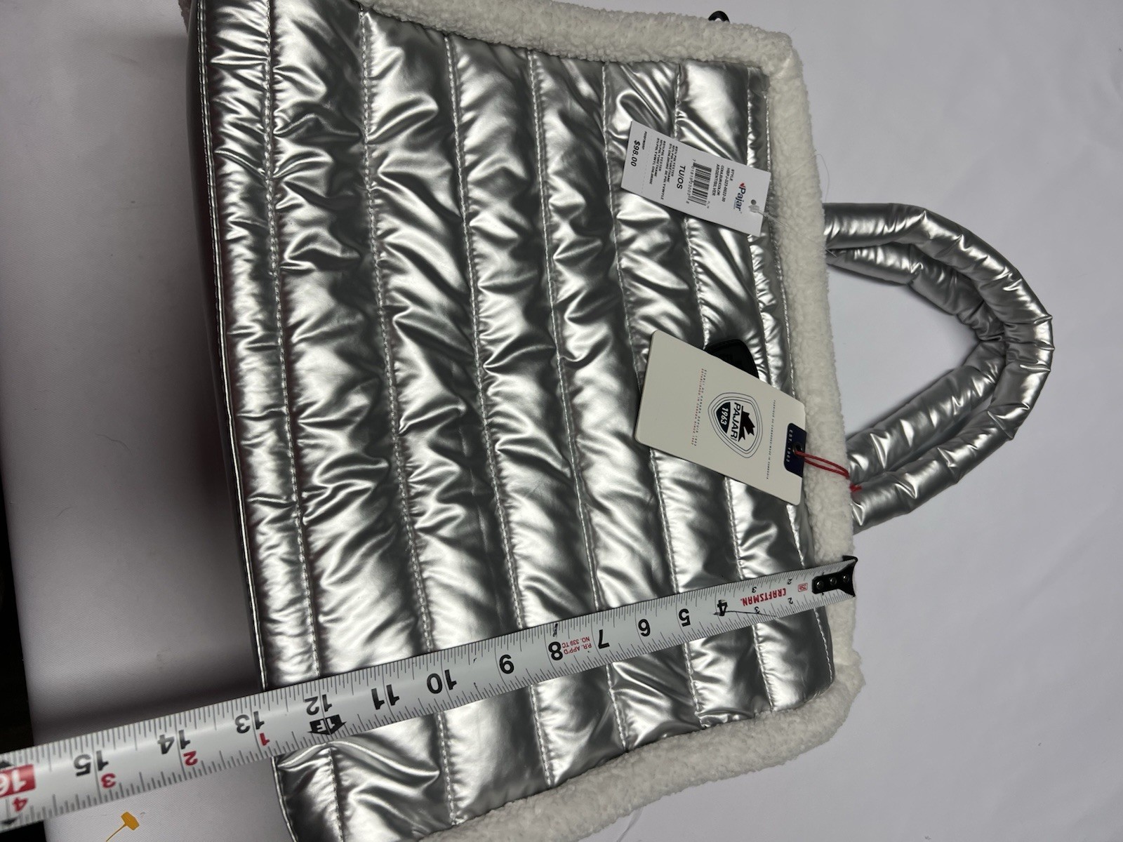 The Pajar 1963 Shearling Puffy Tote is a metallic silver quilted bag NWT