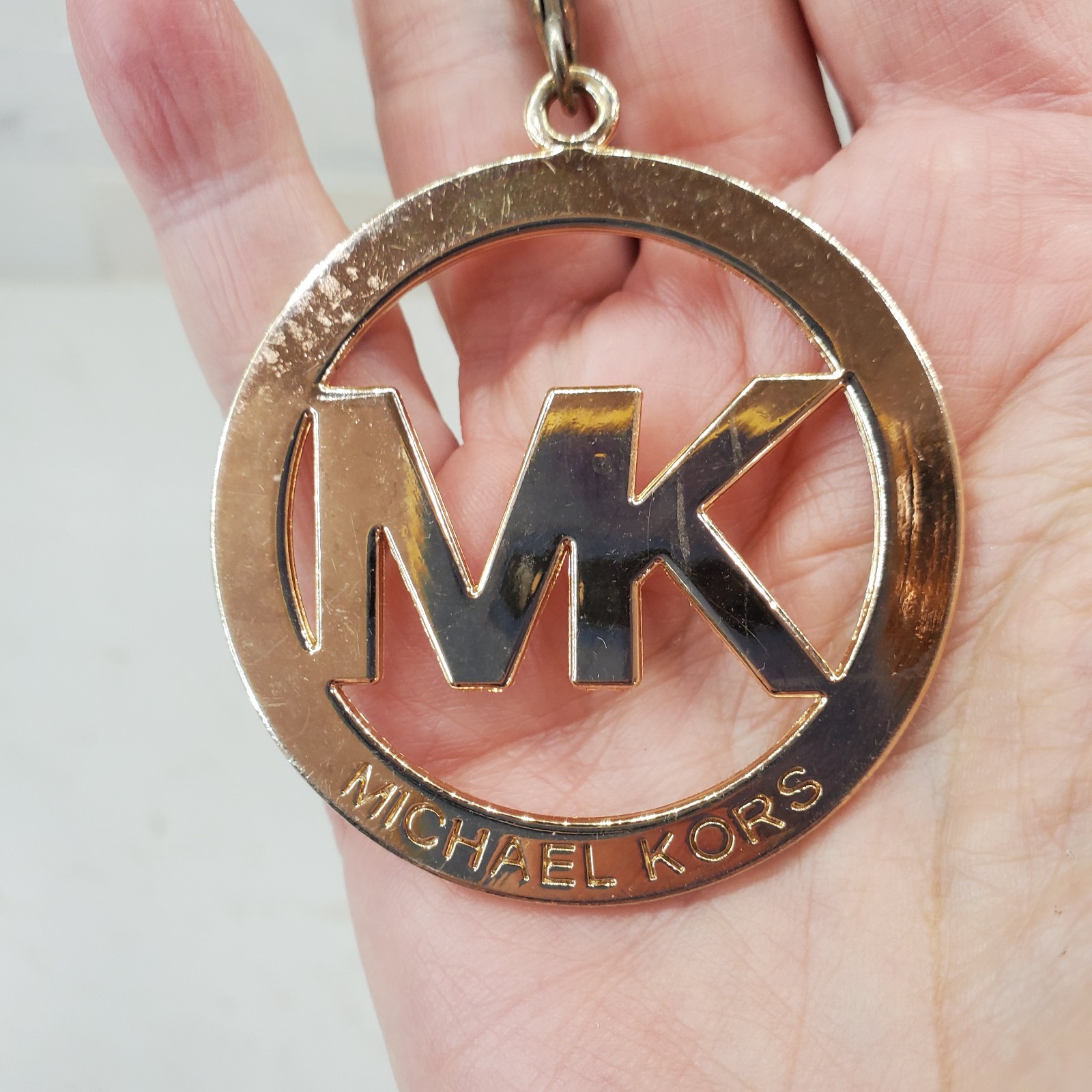 Michael Kors Round Gold Tone Clip On MK Purse Charm w Carabiner