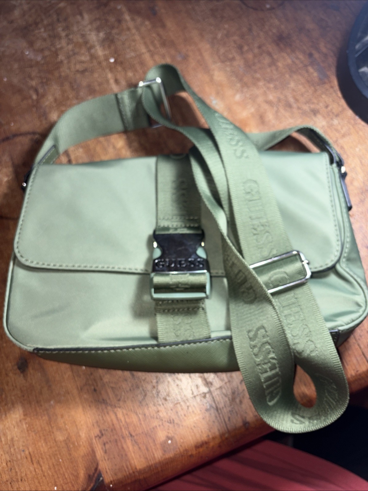 Guess Sage Green Crossbody Silver tone Snap 11 Inches X 6 Inches.