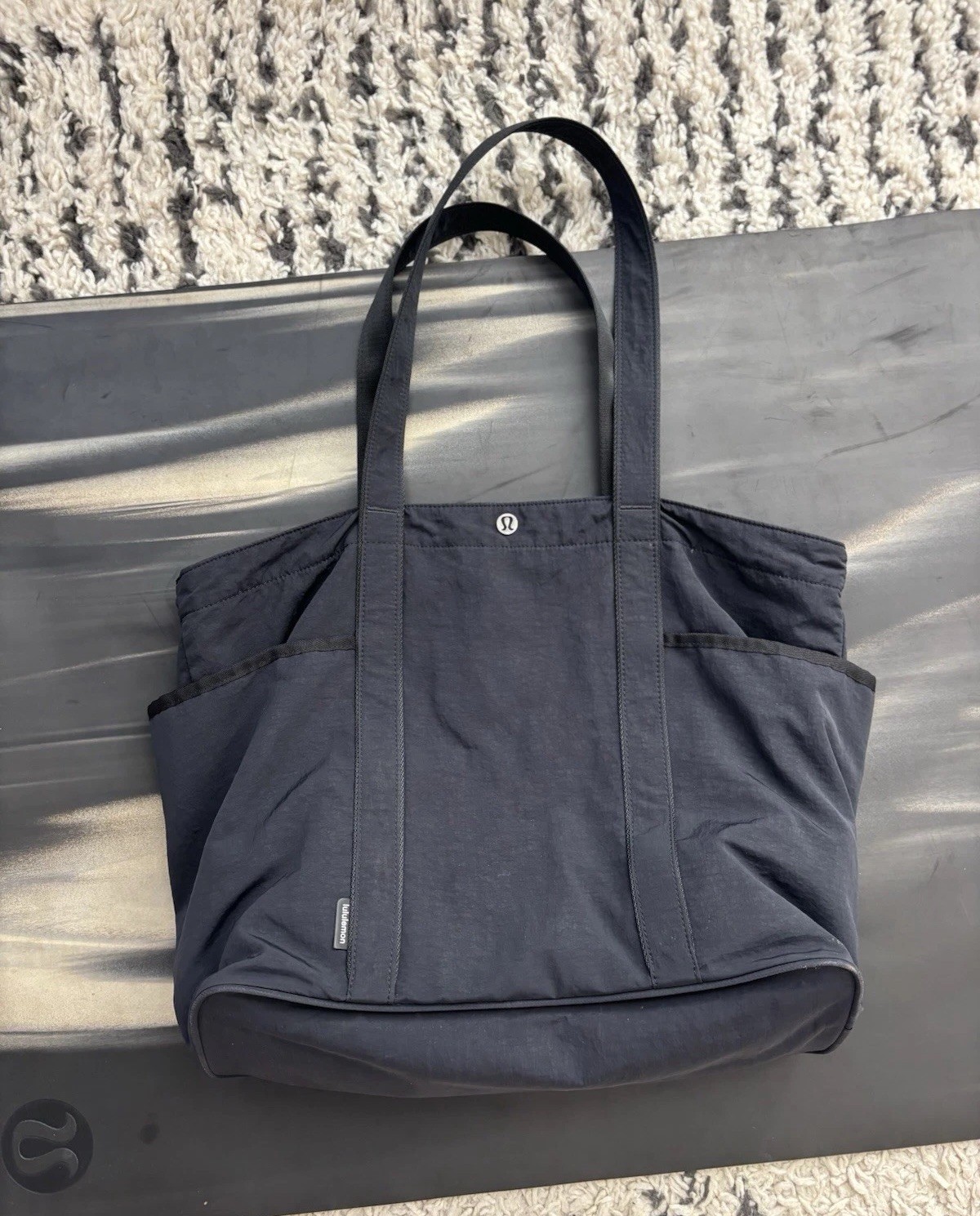 lululemon Black Solid Tote Bag Snap Closure Inner Pockets Silver Hardware