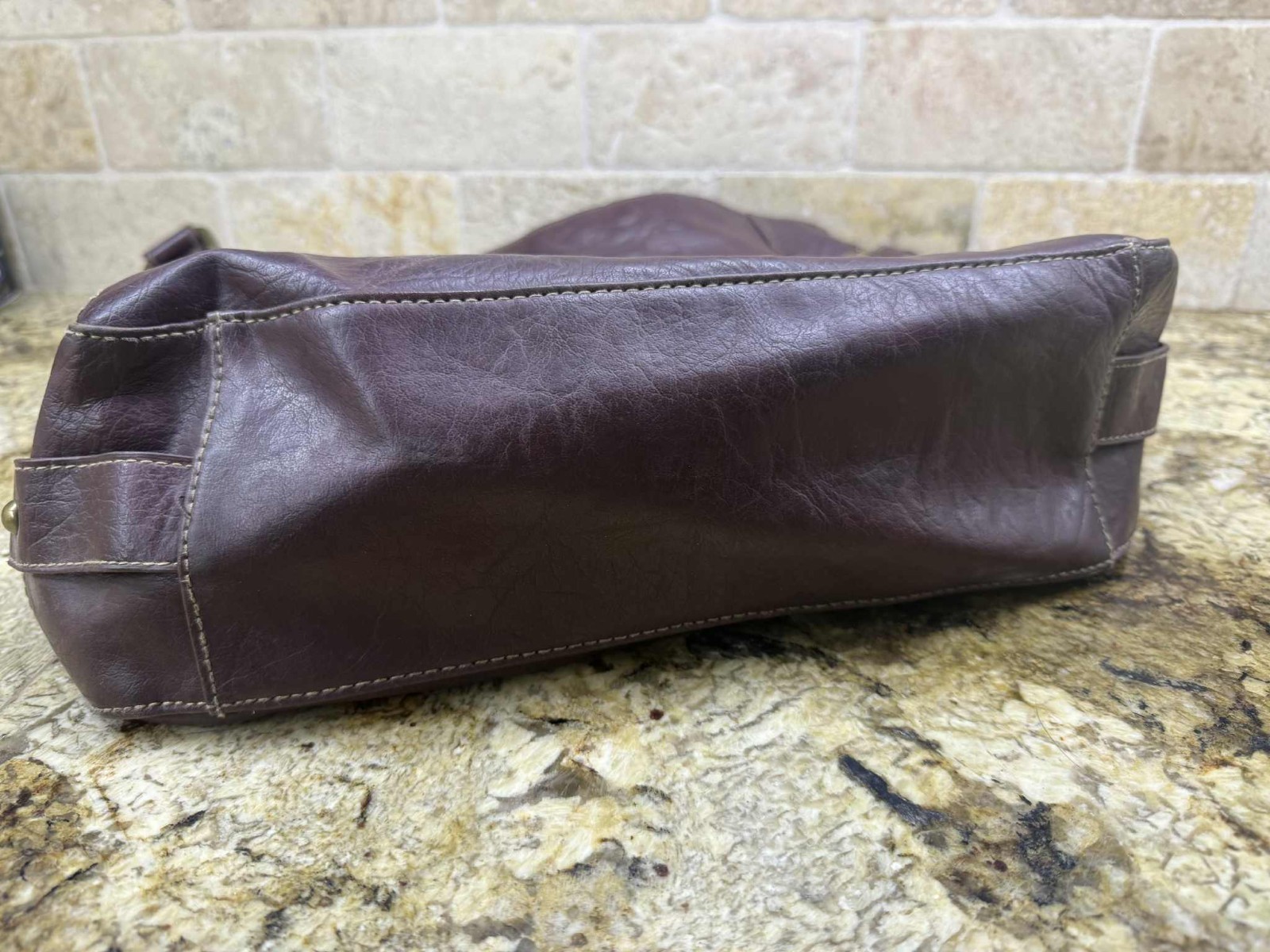 No name: maroon slouchy hobo-style leather handbag with gold buckles