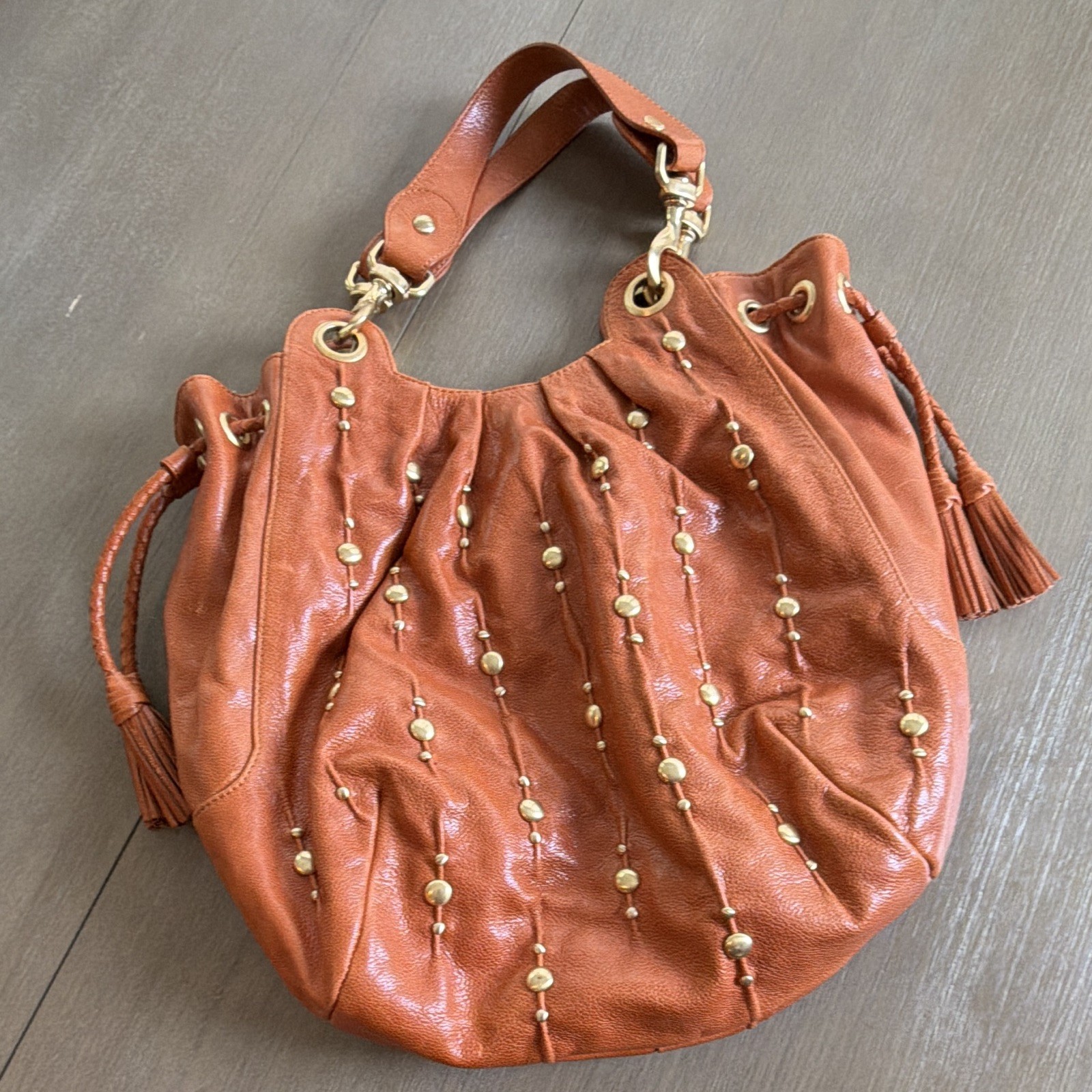 Isabella  Fiore Brown Studded Leather Drawstring Shoulder Bag – Tasseled Strap