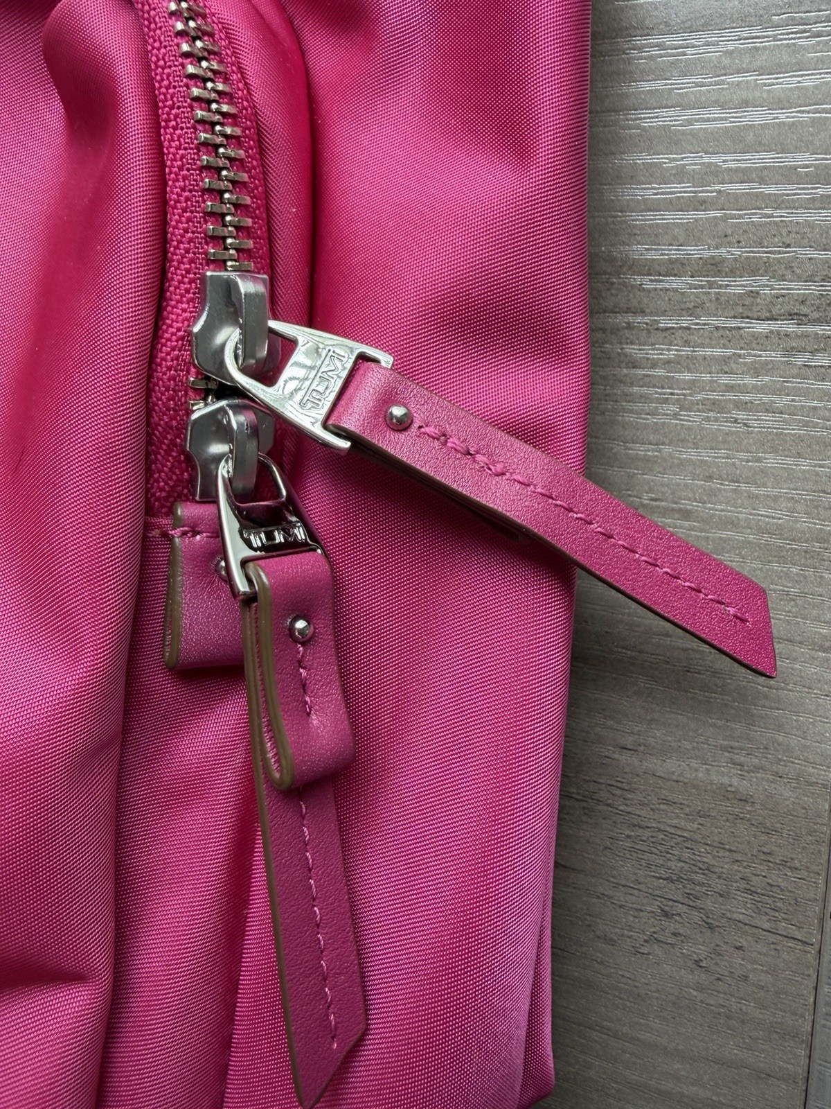 Tumi Pink Crossbody Bag Adjustable Strap Zip Closure Multiple Pockets Lined