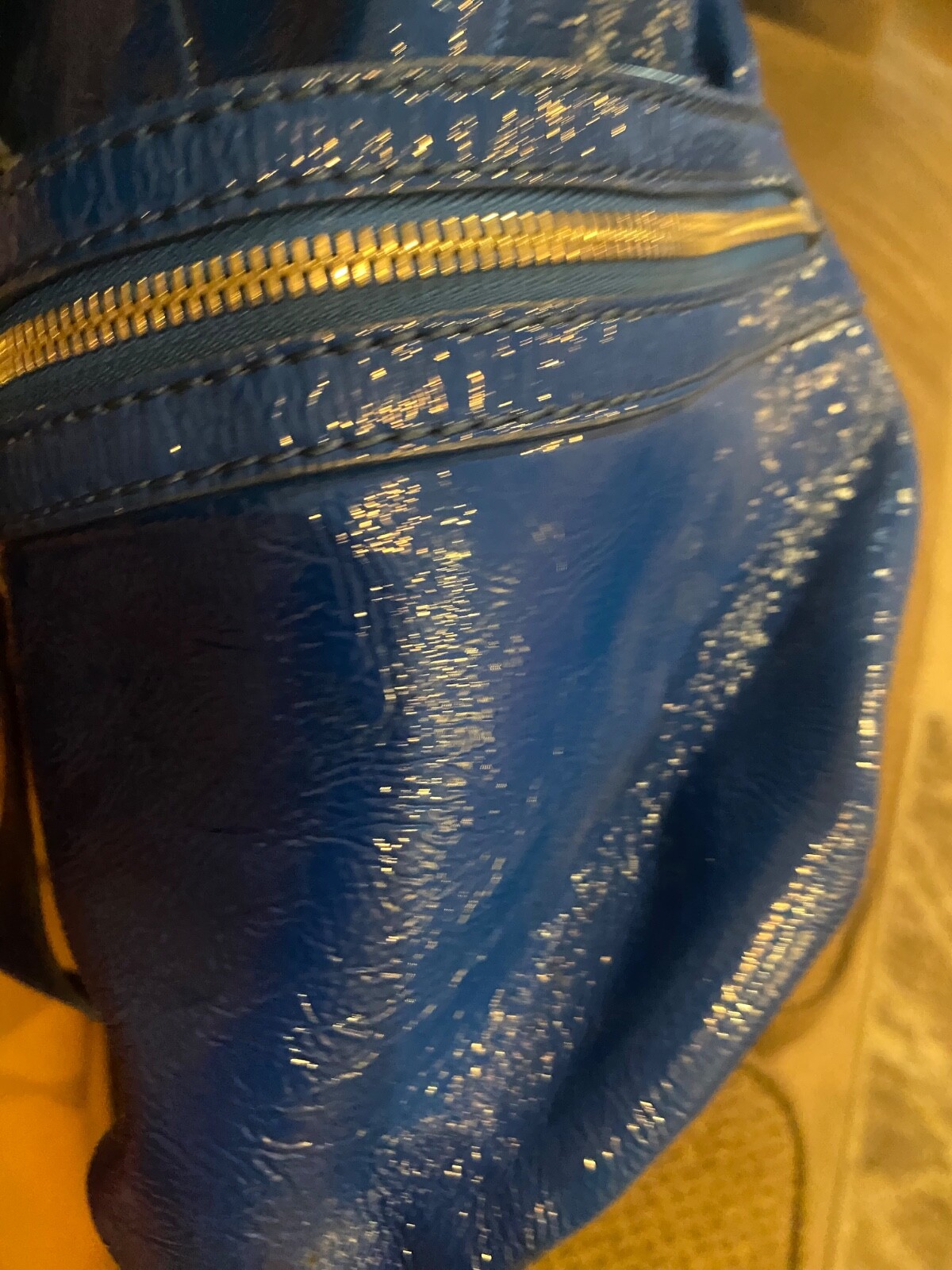 Michael Kors metallic blue, large purse with buckles it 11 inch in heightl