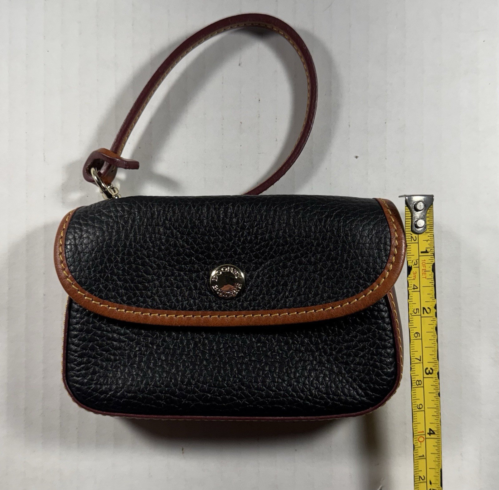 Dooney & Bourke Pebble Leather Snap Button Wristlet Black/Brown w/Red Lining L.N