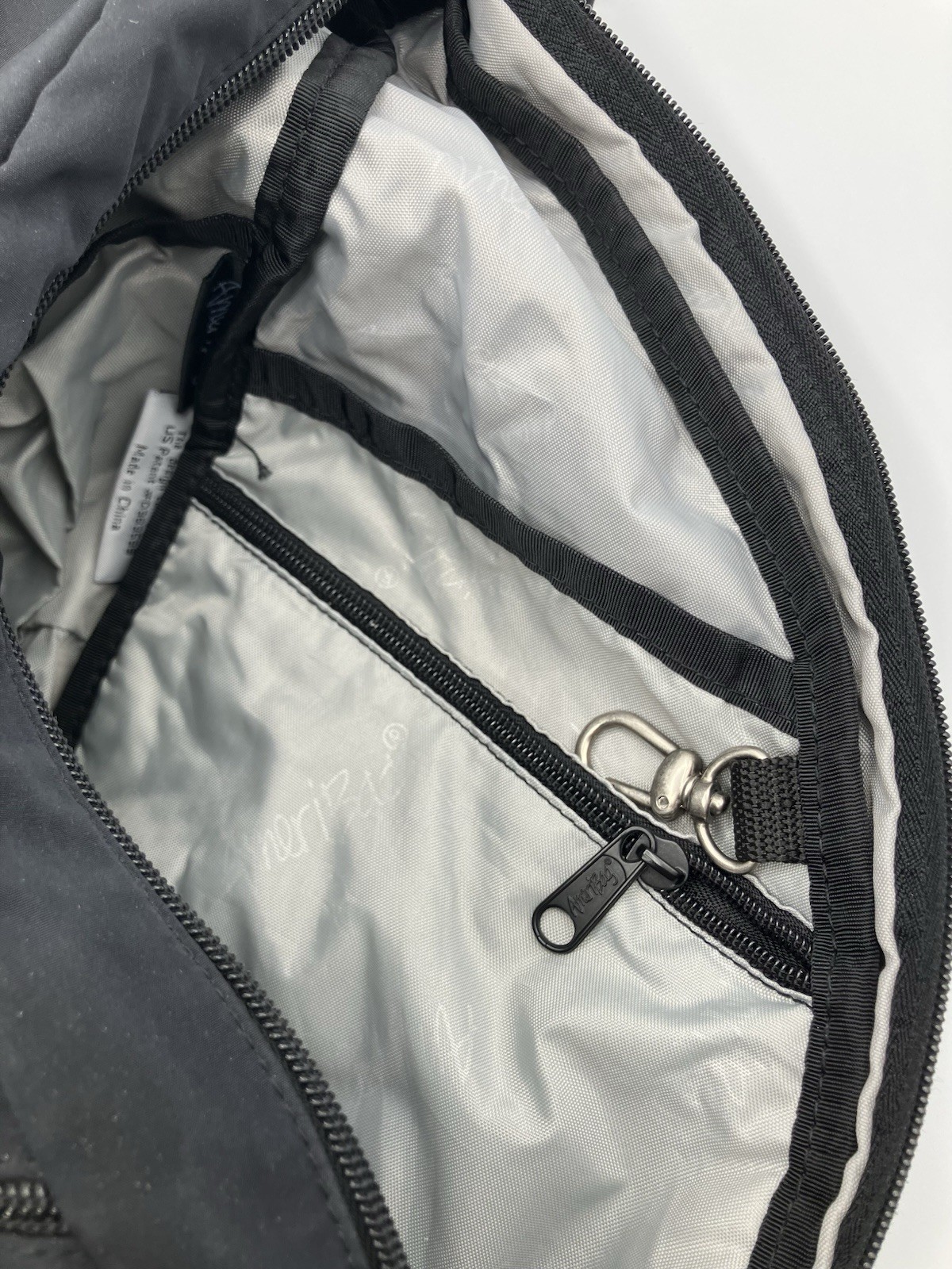 AmeriBag Healthy Back Bag Sling Backpack Crossbody Black Nylon Lightweight Purse