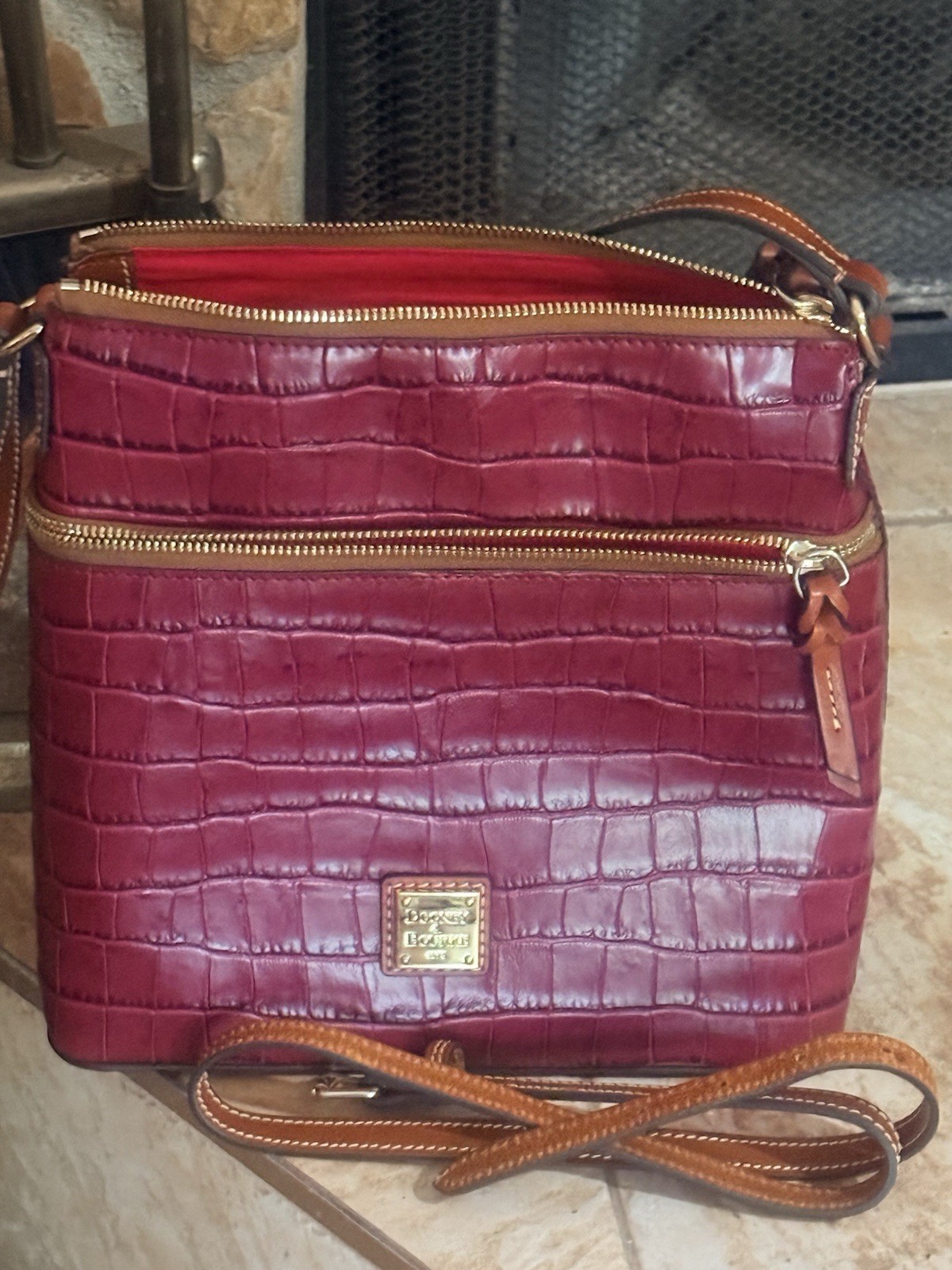 Dooney & Bourke Burgundy Embossed Crossbody Bag Zip, Pockets, Brown Strap