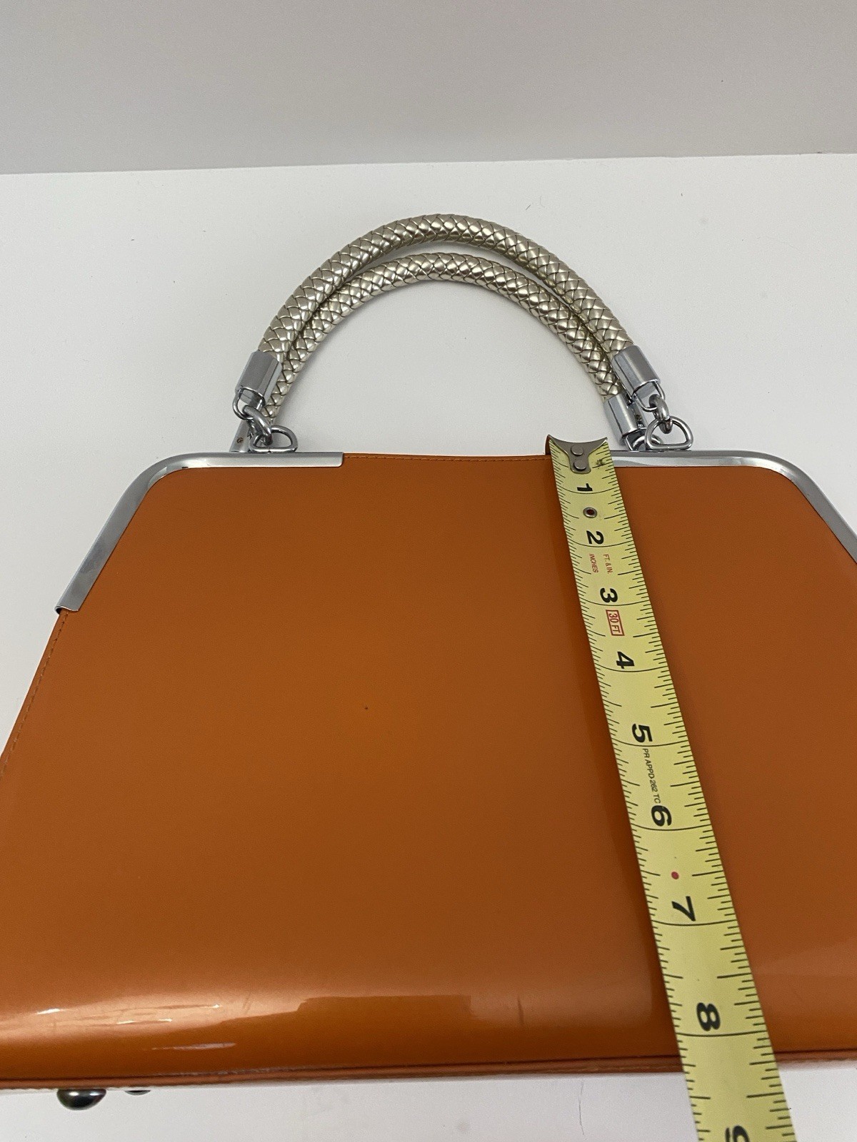 MC Collection handbag Glossy Orange with Braided silver handle and strep Pre own