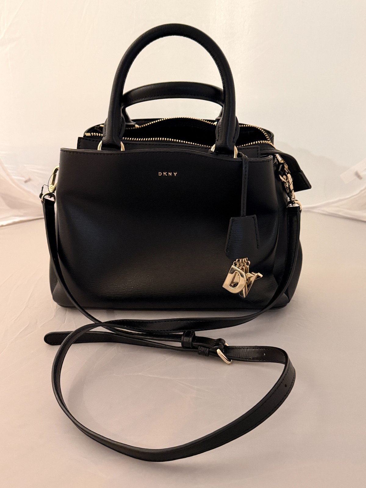 DKNY Black Leather Satchel Handbag with Gold Hardware and Shoulder Strap