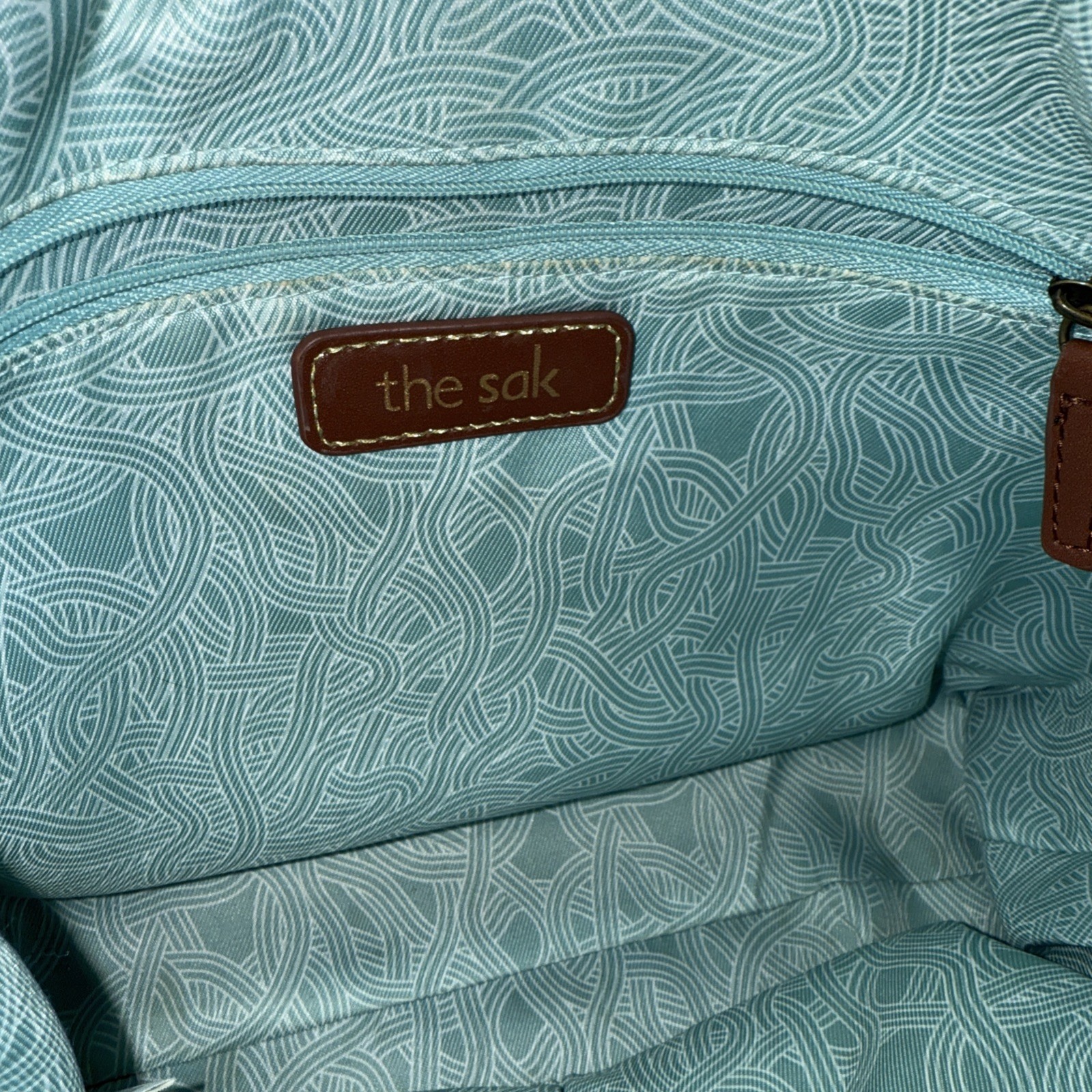 The Sak Indio Two Tone Brown Leather Alameda Purse Snake Skin Pattern Strap