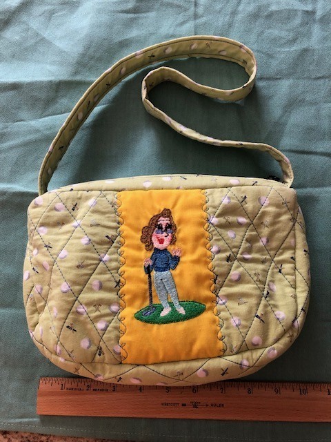 purse – embroidered lady golfer, light green cotton fabric with golf balls/tees