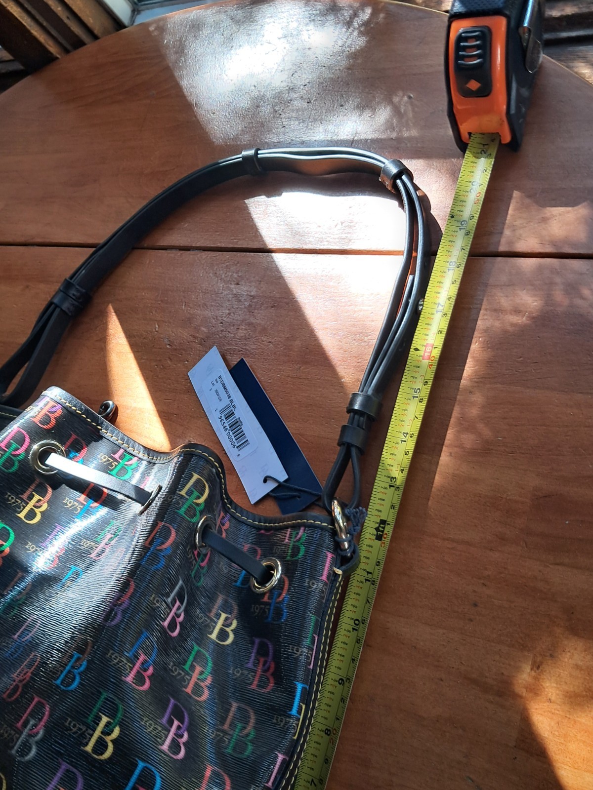 Dooney & Bourke Blakely Collection Tasha Logo Bone Drawstring Bag BNWT Rainbow