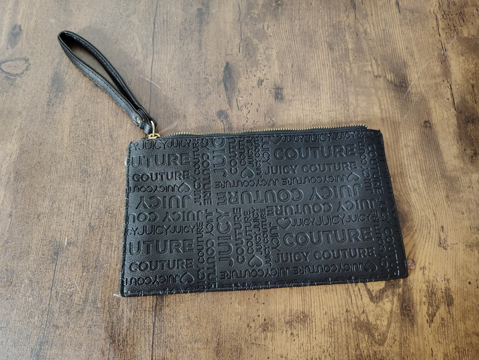 Juicy Couture Black Hand Zip wristlet embossed monogram pattern 5.5in x 9.5in