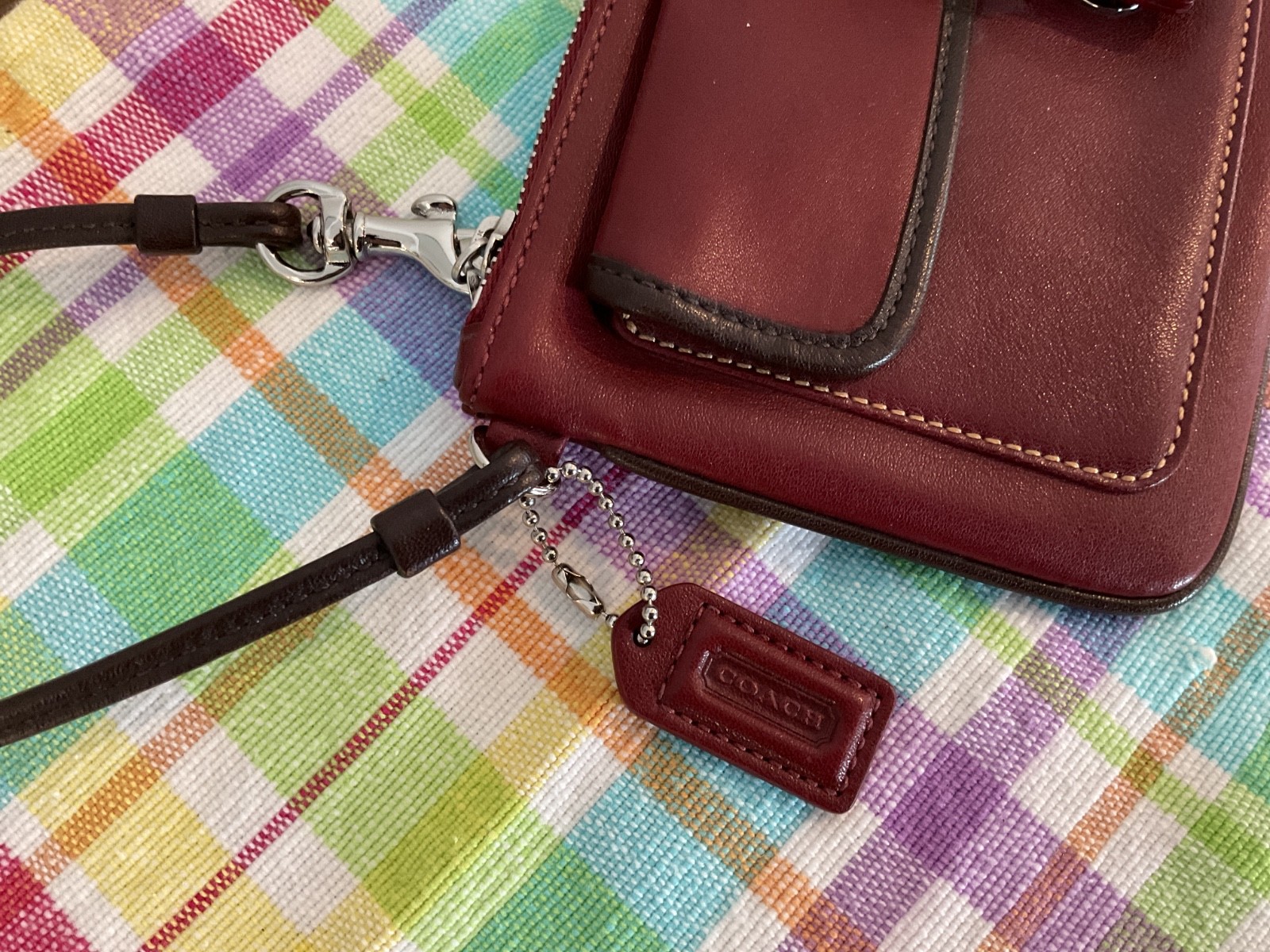COACH. Burgundy Leather SOHO Clutch Wristlet Buckle Snap Silver Hardware NWOT
