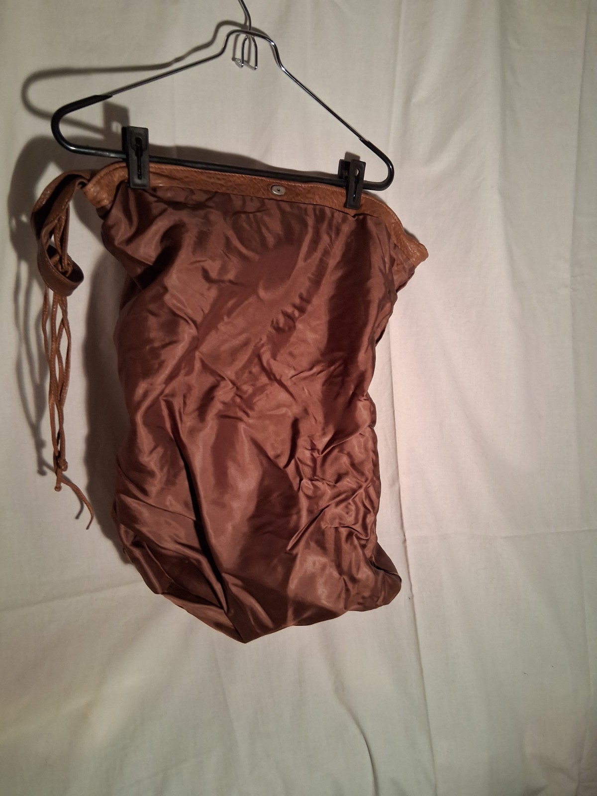 Chestnut supple leather saddlebag. 10″ high with flap closed. 16″ wide.