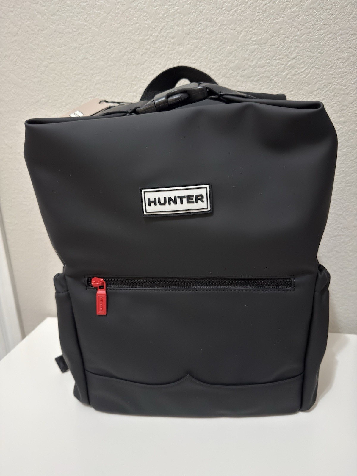 Hunter Top Clip Backpack in Black Color With A Top Buckle Closure.