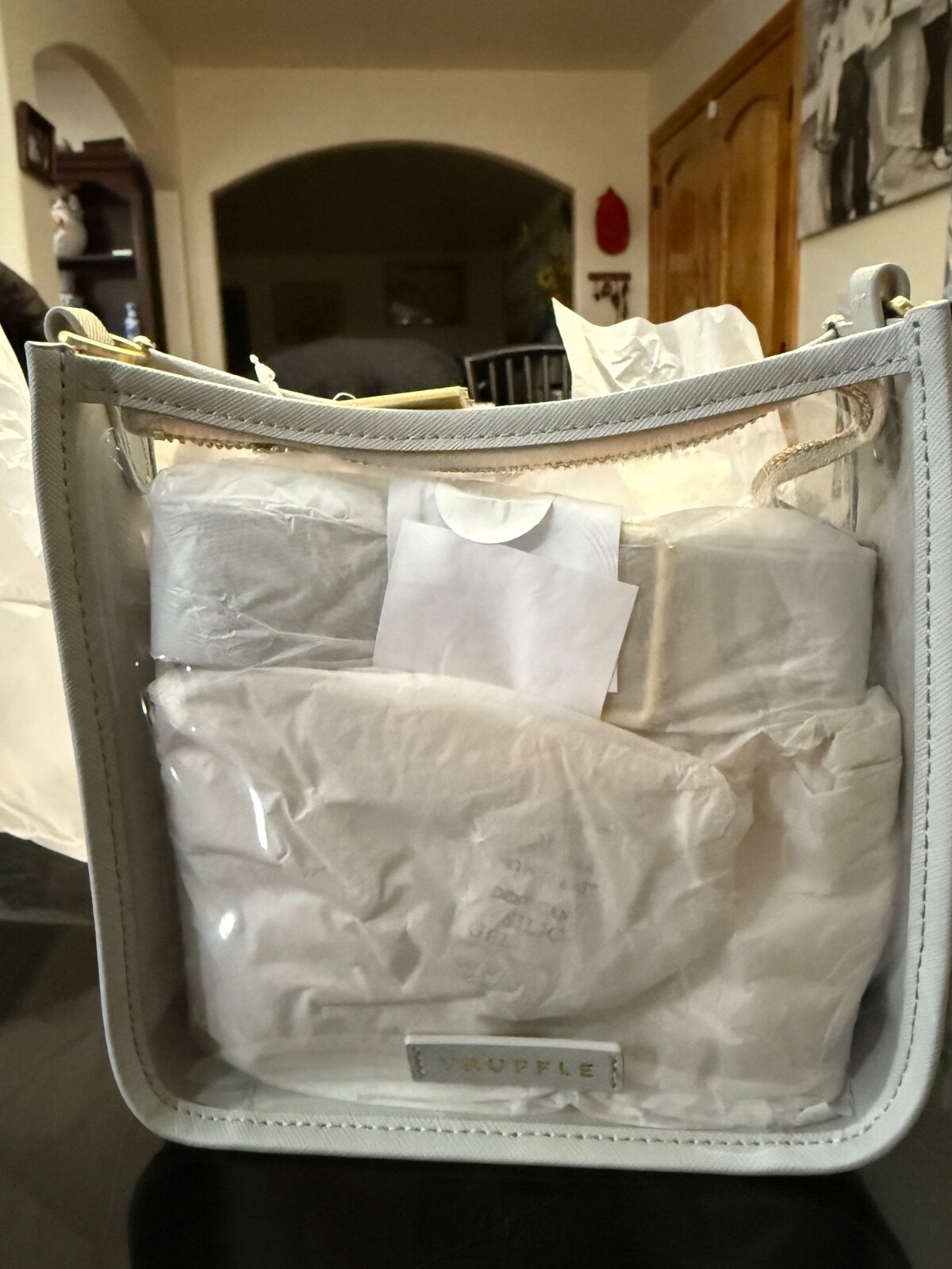 Truffle clarity mini crossbody carryall, color is Dove grey
