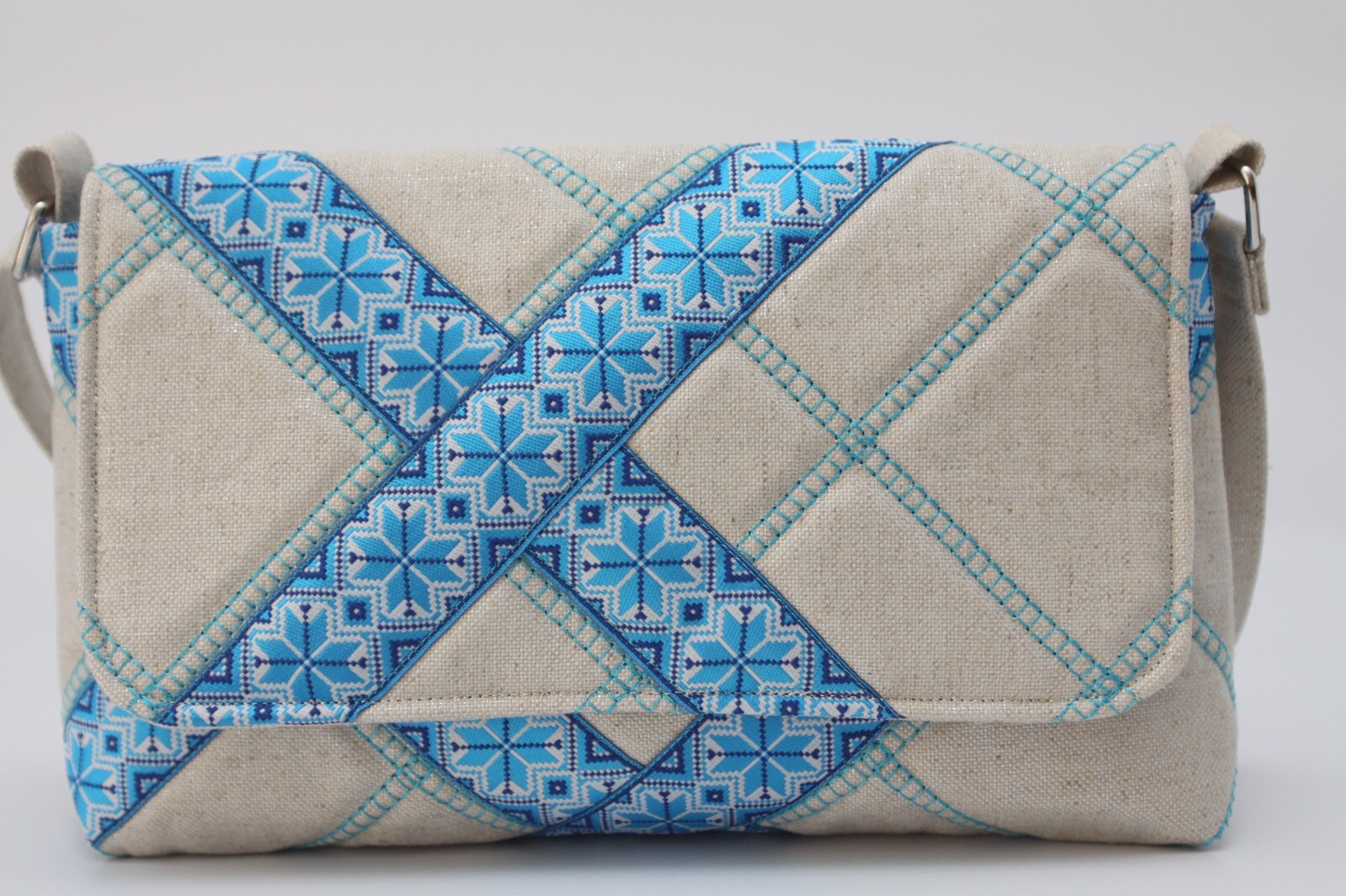 Women’s Shimmer Cotton Handbag Blue Embroidered Trim Flap Snap Closure.