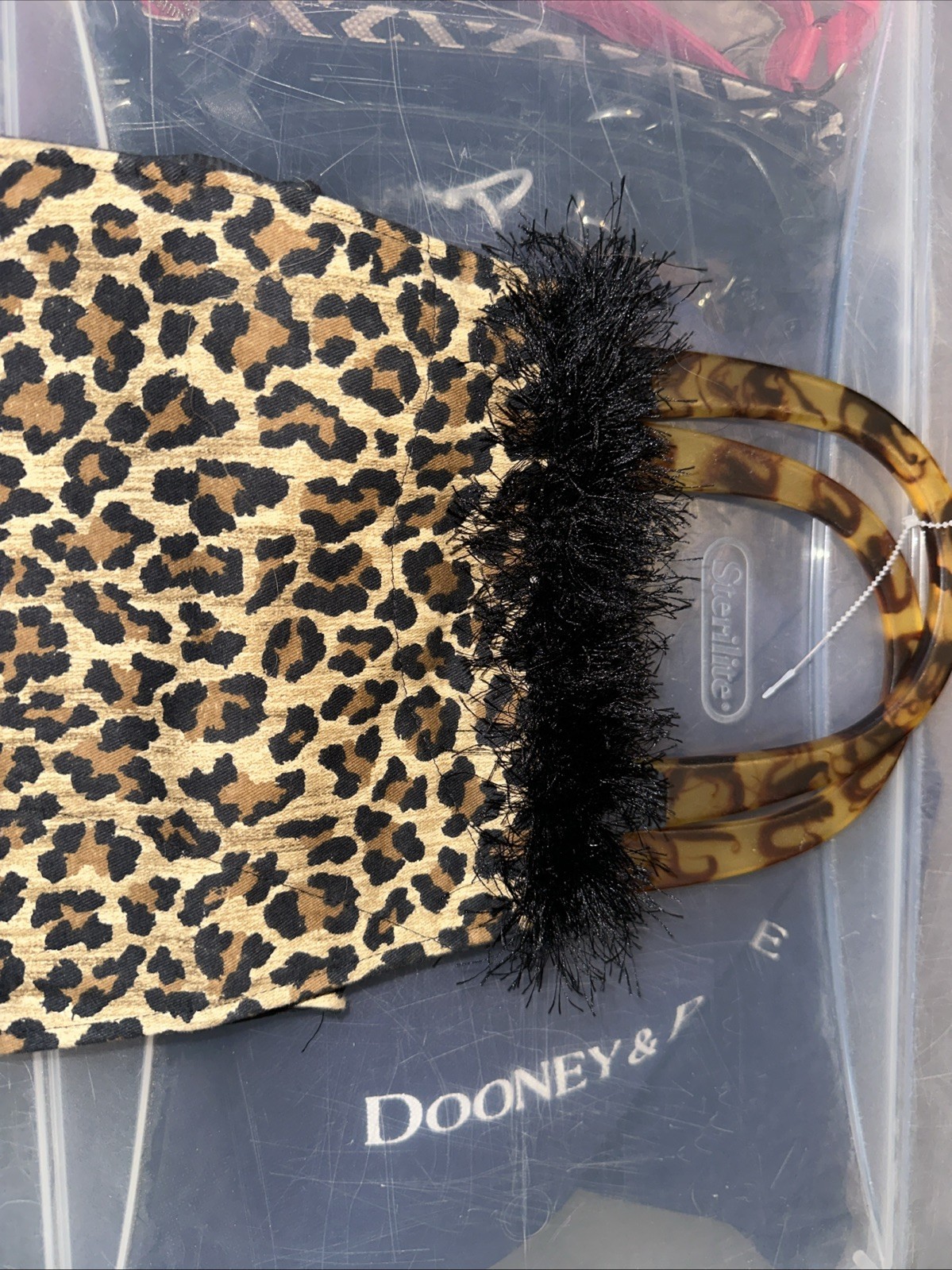 fuzzy small satchel handbag features a leopard print tortoiseshell-style handles