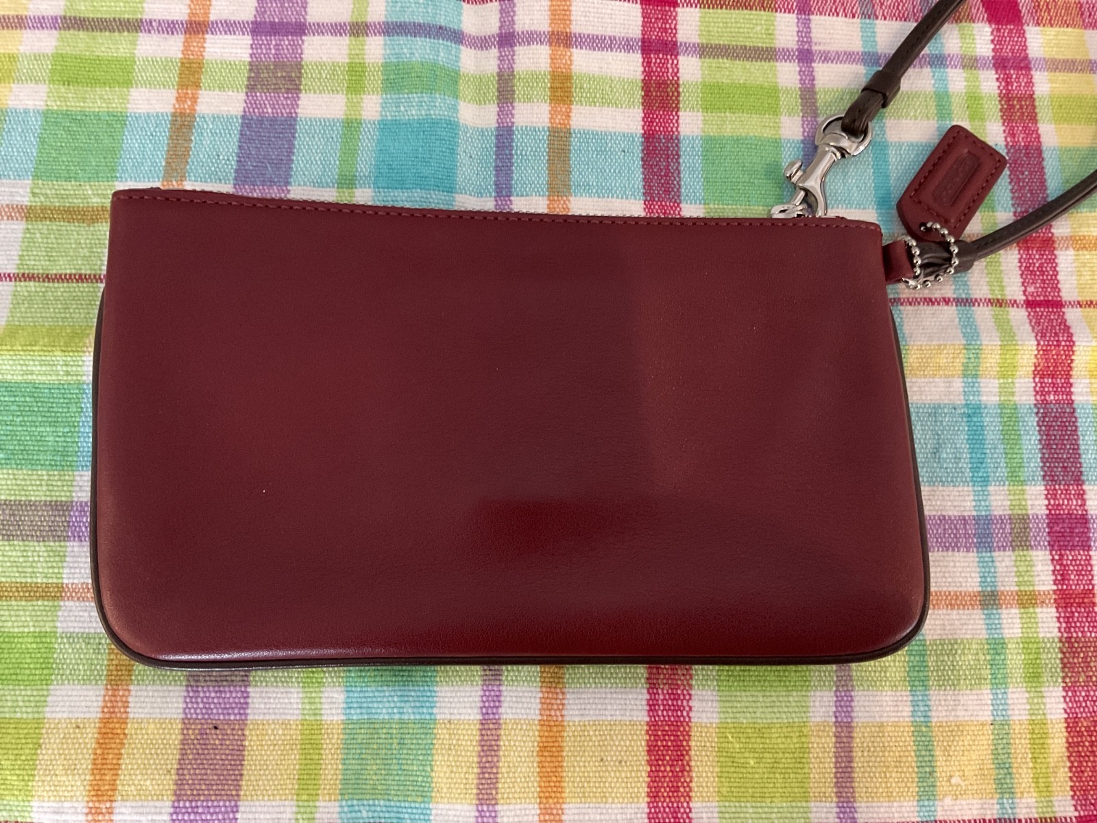 COACH. Burgundy Leather SOHO Clutch Wristlet Buckle Snap Silver Hardware NWOT