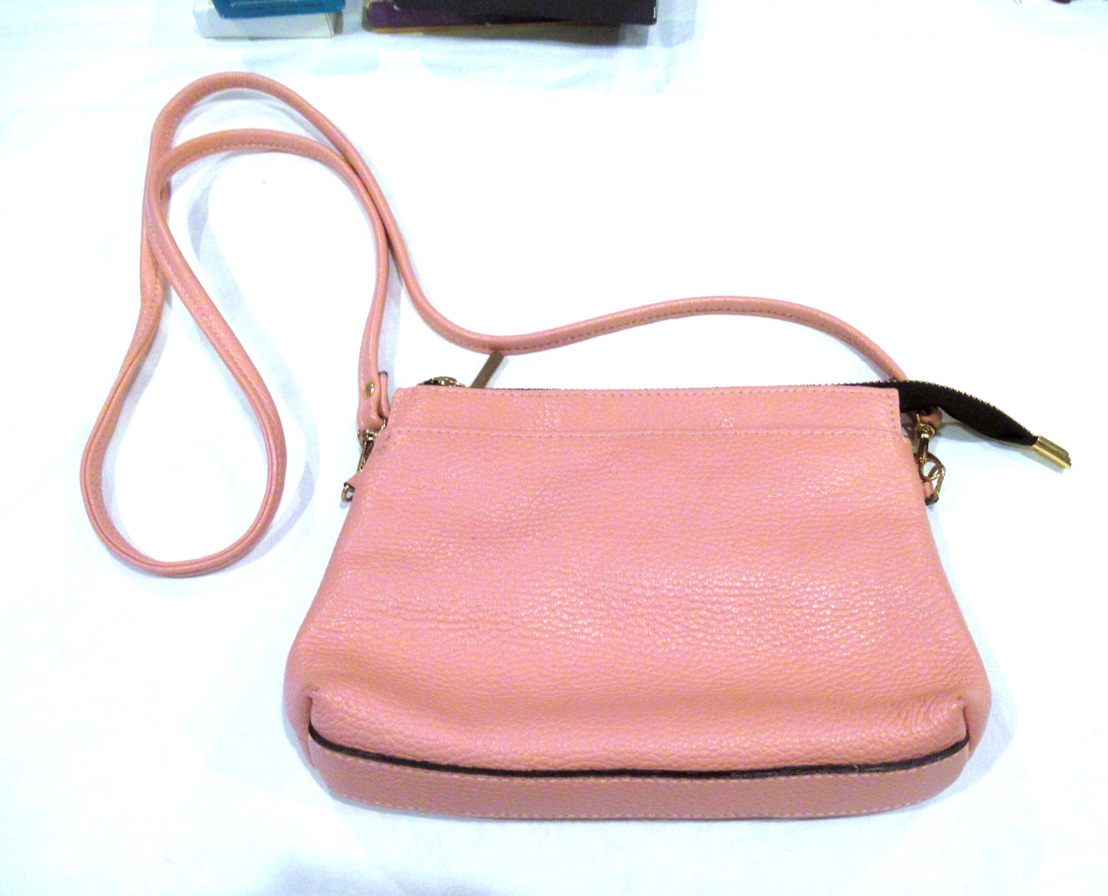 A Bellucci pink leather purse, crossbody strap