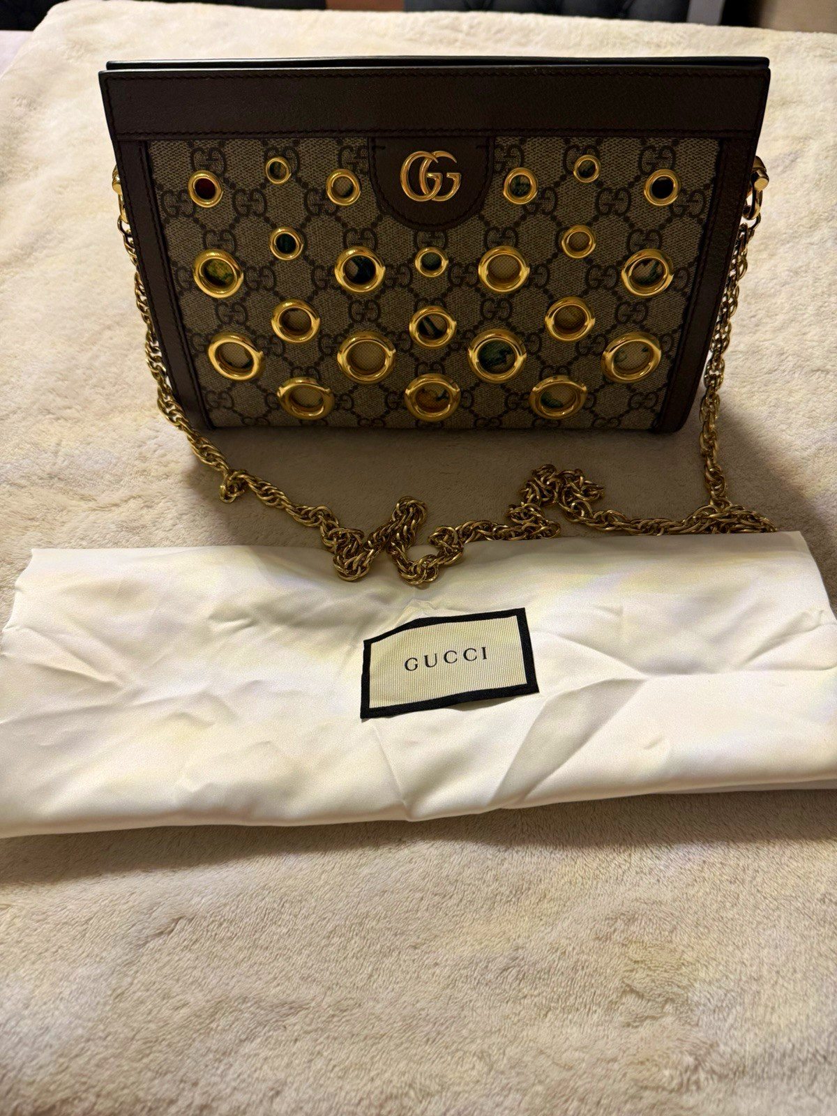 Gucci GG Monogram Clutch Gold Chain with Grommet Accent Serial Number E038081224