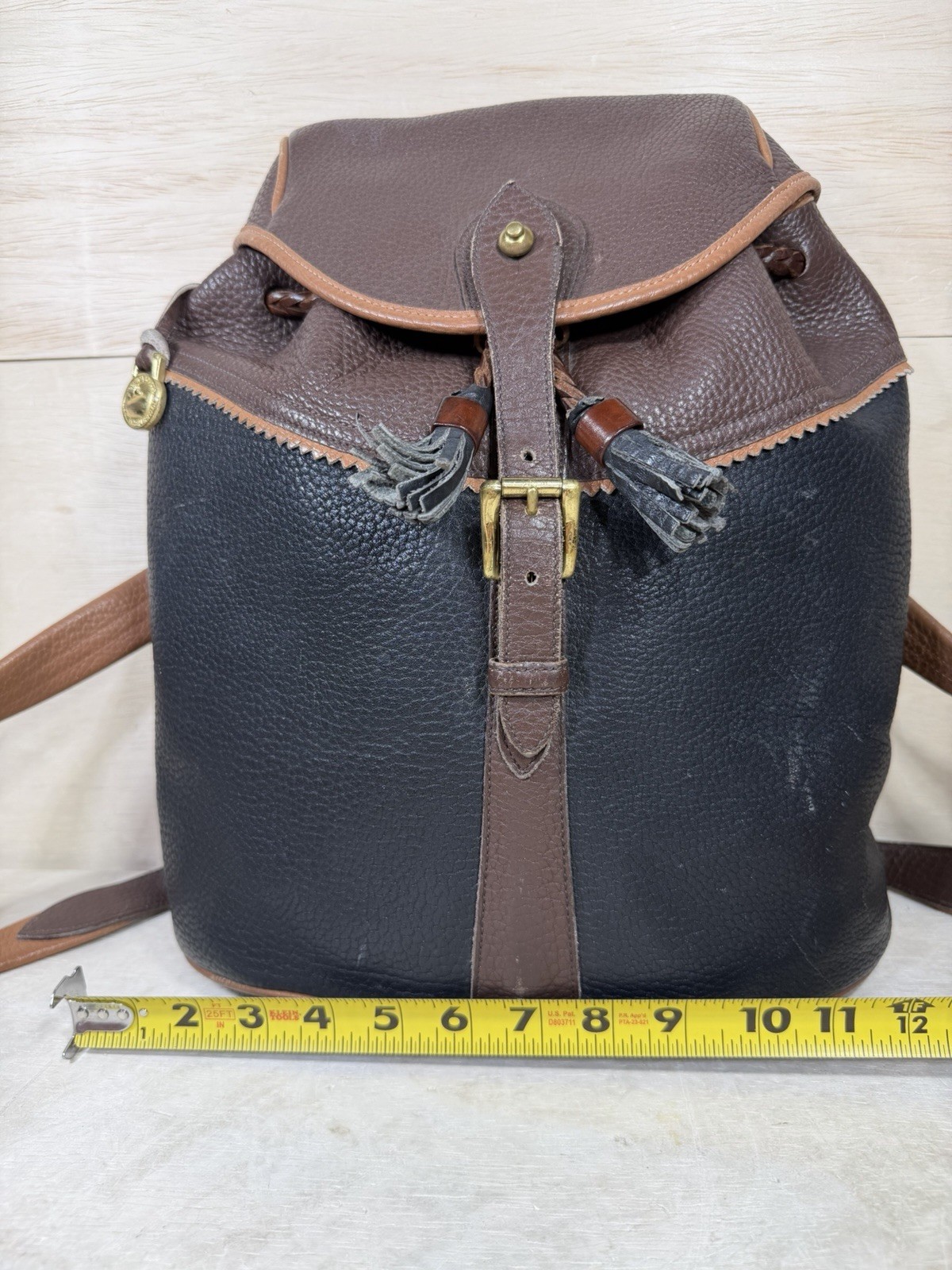 Vintage Dooney & Bourke Black Brown Pebbled Leather Drawstring Backpack Tassels