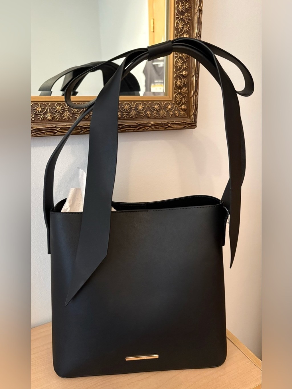 ALDO black leather bucket-style tote w/ bow accent handle, contemporary design