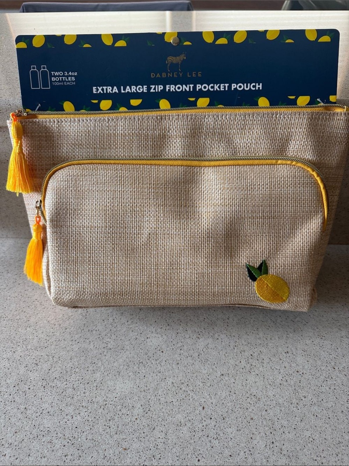 Dabney Lee Natural Looking Straw Pouch with Yellow Accents and Embroidered Lemon