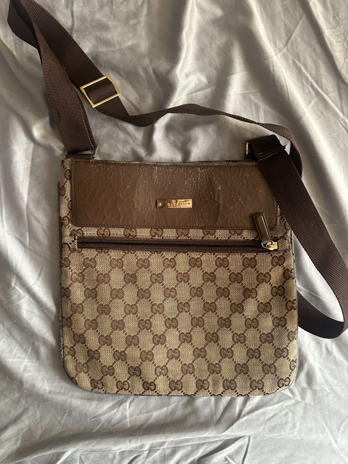 old designer handbag with cross body strap