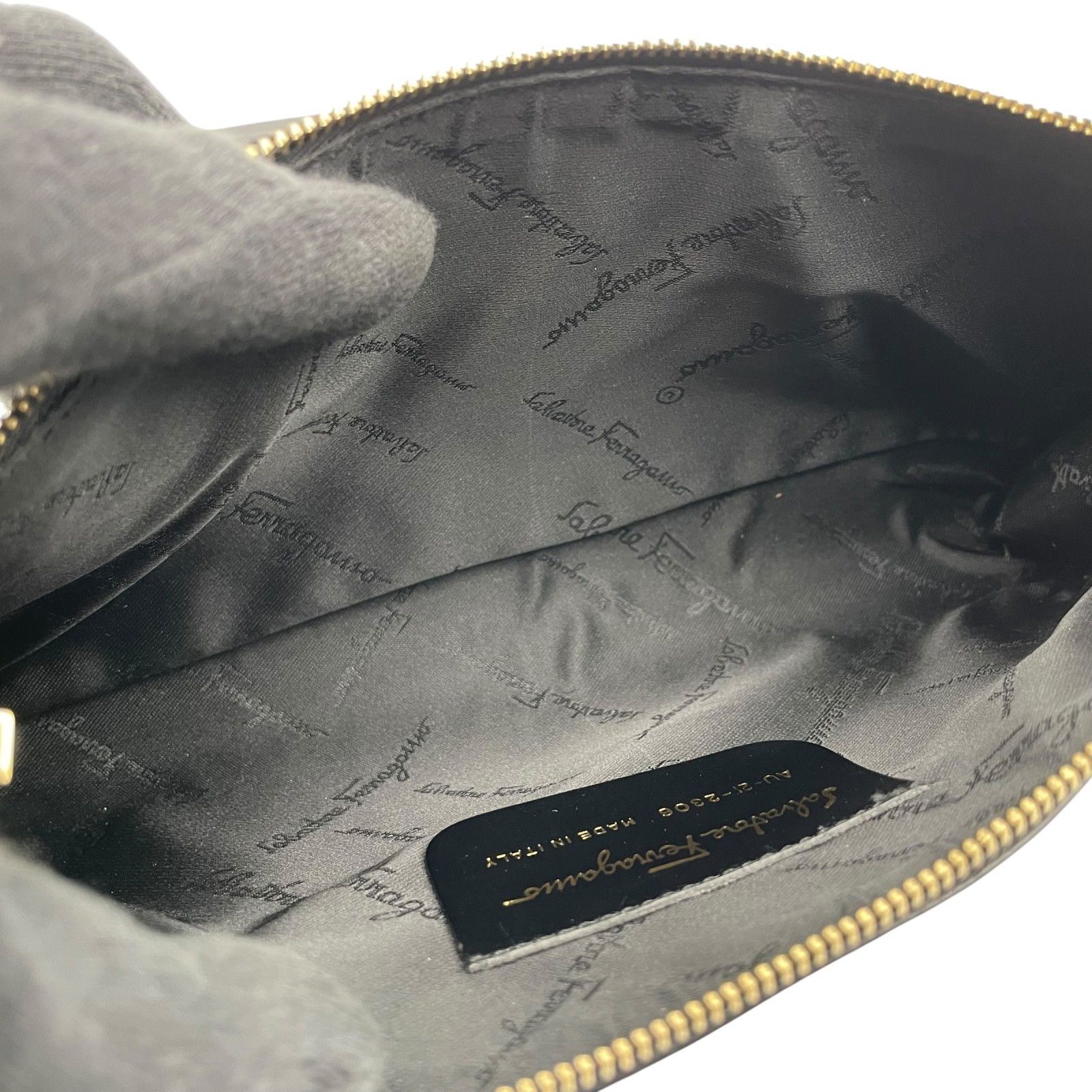 Authentic Salvatore Ferragamo Gancini Leather Accessory Pouch Black Gold