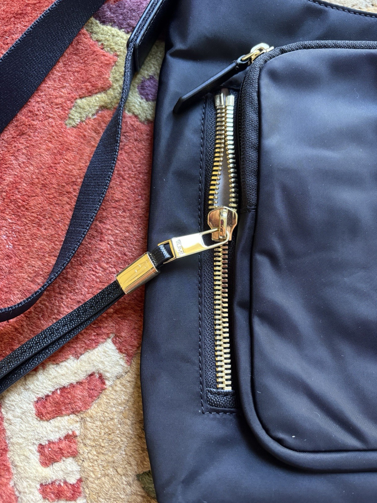 TUMI Voyageur Black Medium Crossbody Bag Zip Closure Gold Hardware travel