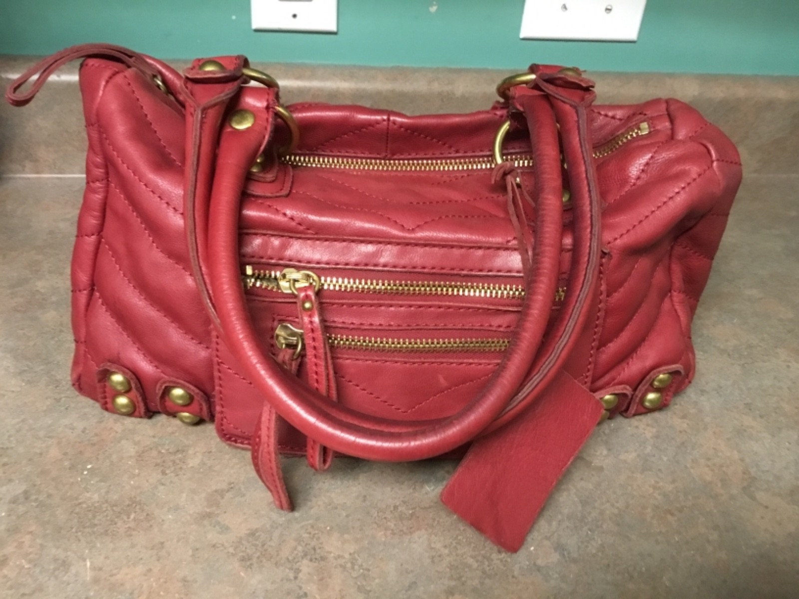 LINEA PELLE DYLAN QUILTED CHEVRON LARGE SPEEDY SATCHEL RED (CON19)