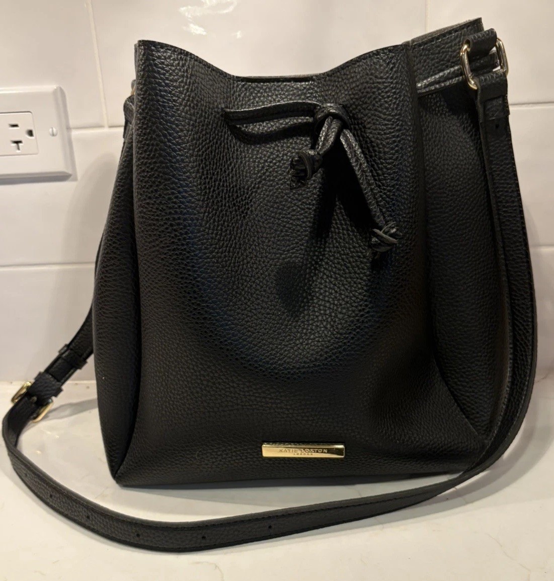Katie Loxton London Bucket Crossbody Bag Purse Vegan Leather Drawstring Black