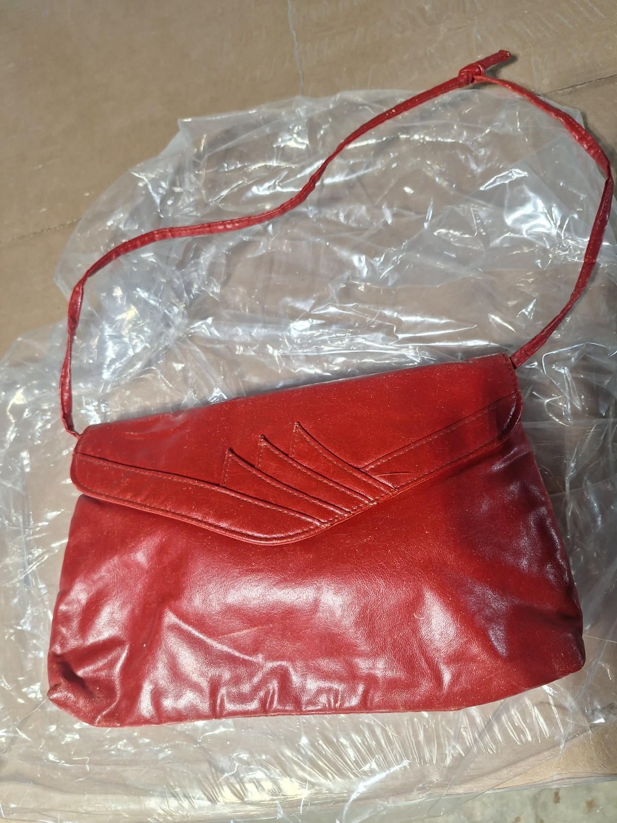 Red faux leather vintage clutch 12 inches wide 8 inches in length 7 inches deep