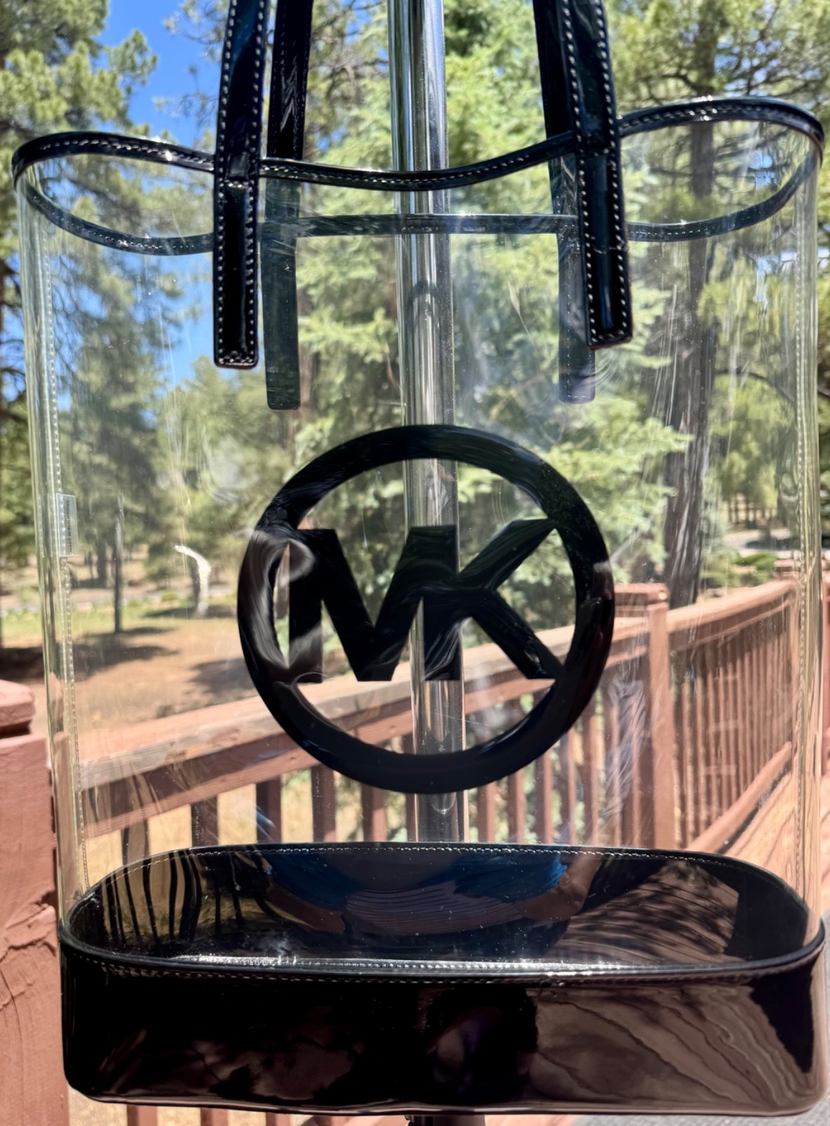 Michael Kors clear and black vinyl beach tote with oversized logo and open top
