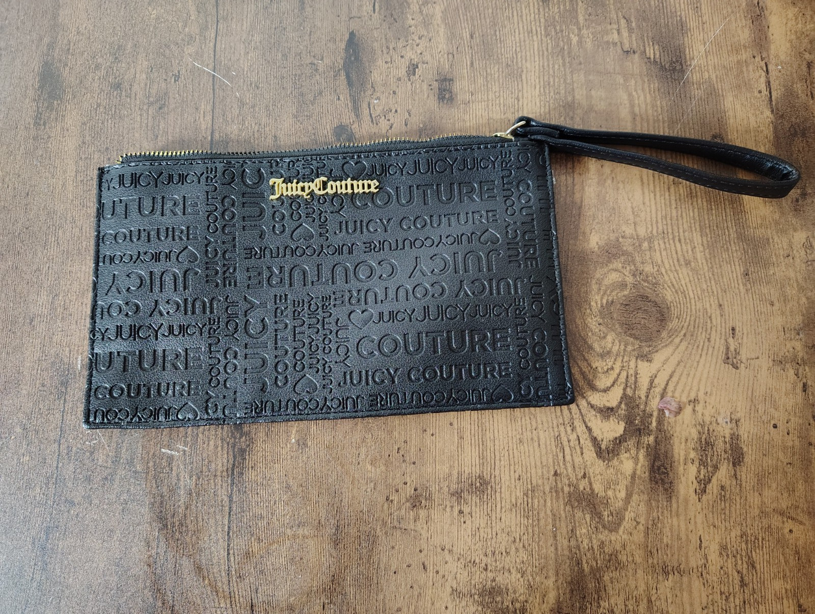 Juicy Couture Black Hand Zip wristlet embossed monogram pattern 5.5in x 9.5in
