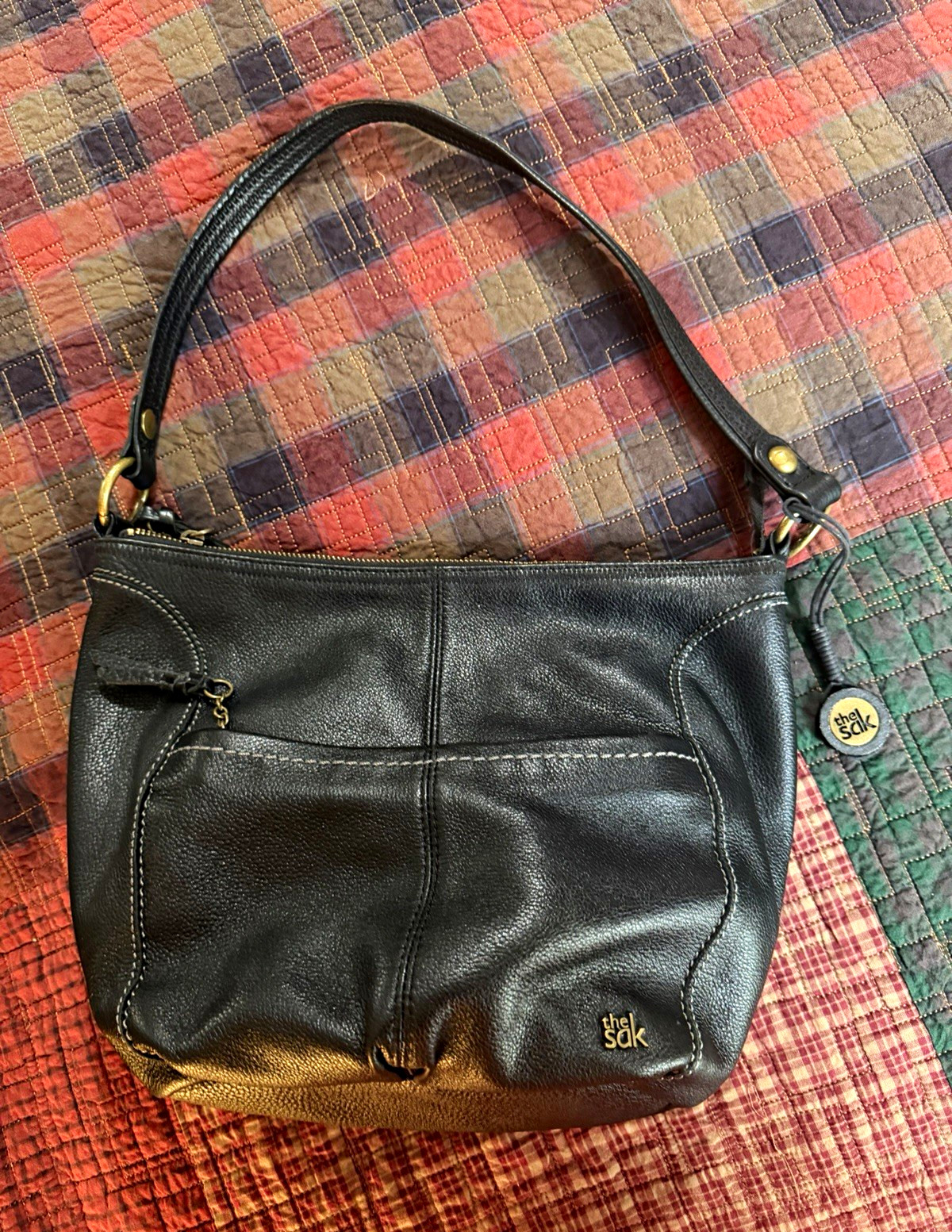 The Sak Black Pebbled Crescent Shoulder Bag Zip Top Multicolor Lining Charm
