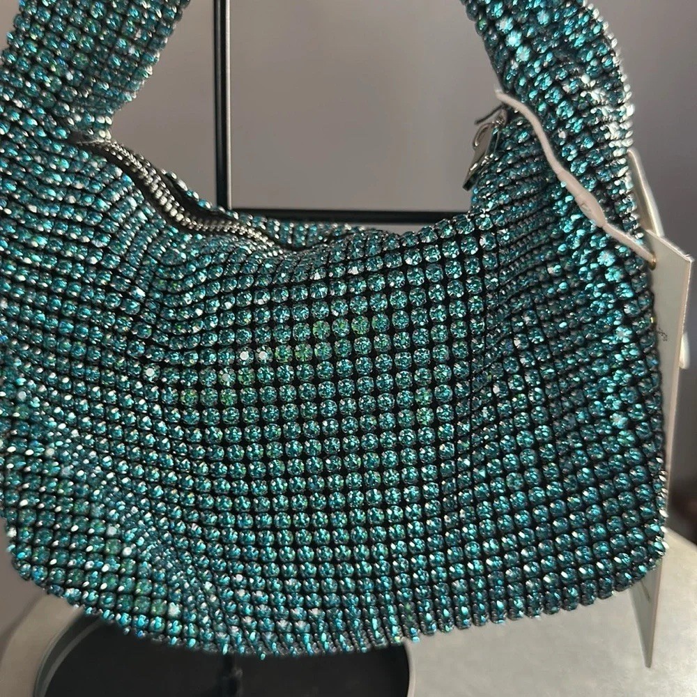 Madison West aqua knotted rhinestone dumpling handbag