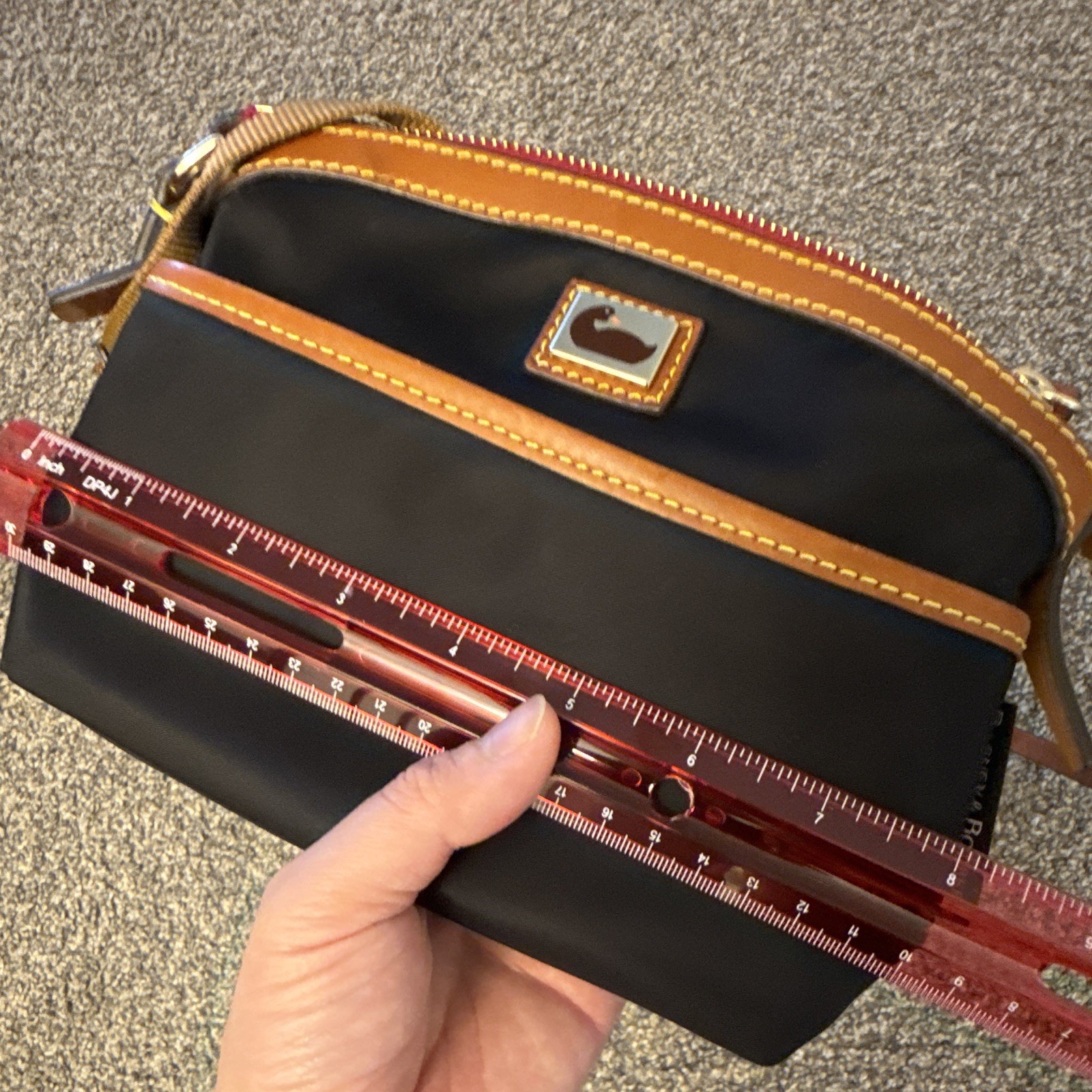 Dooney & Bourke Wayfarer Domed Crossbody Bag in black nylon with brown leather
