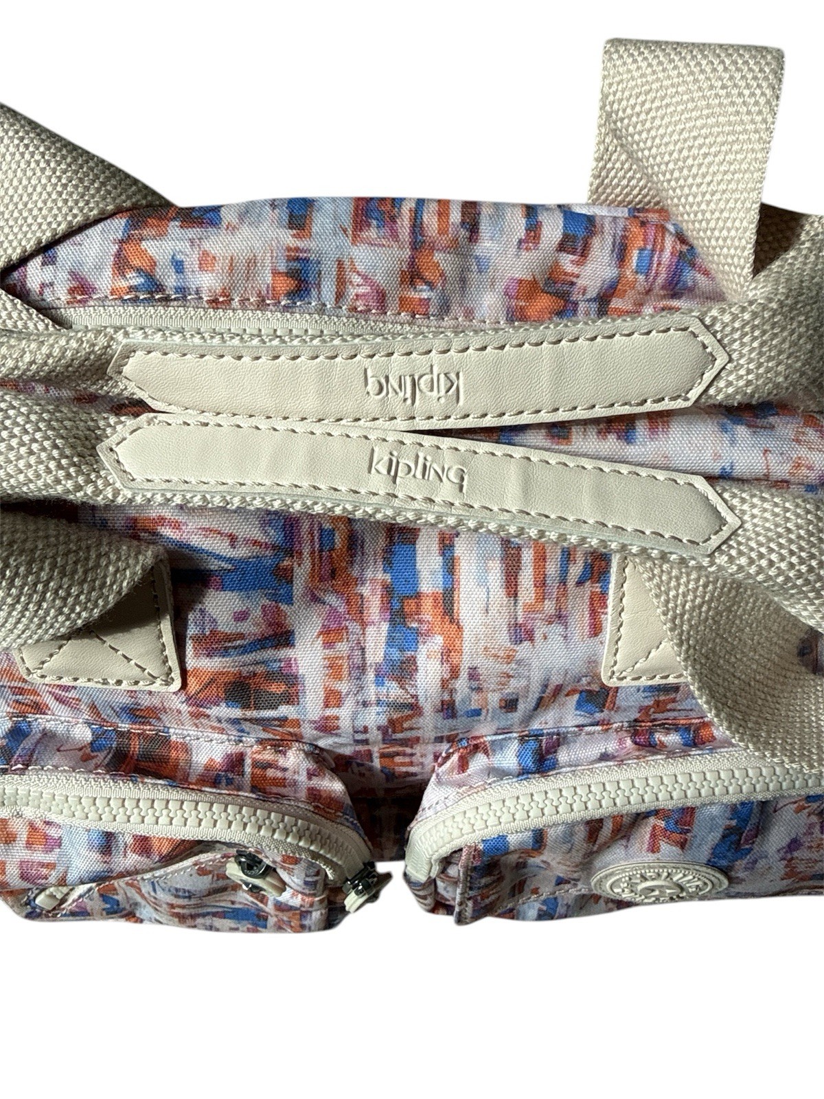 Kipling Defea shoulder bag featuring multiple organizational pockets